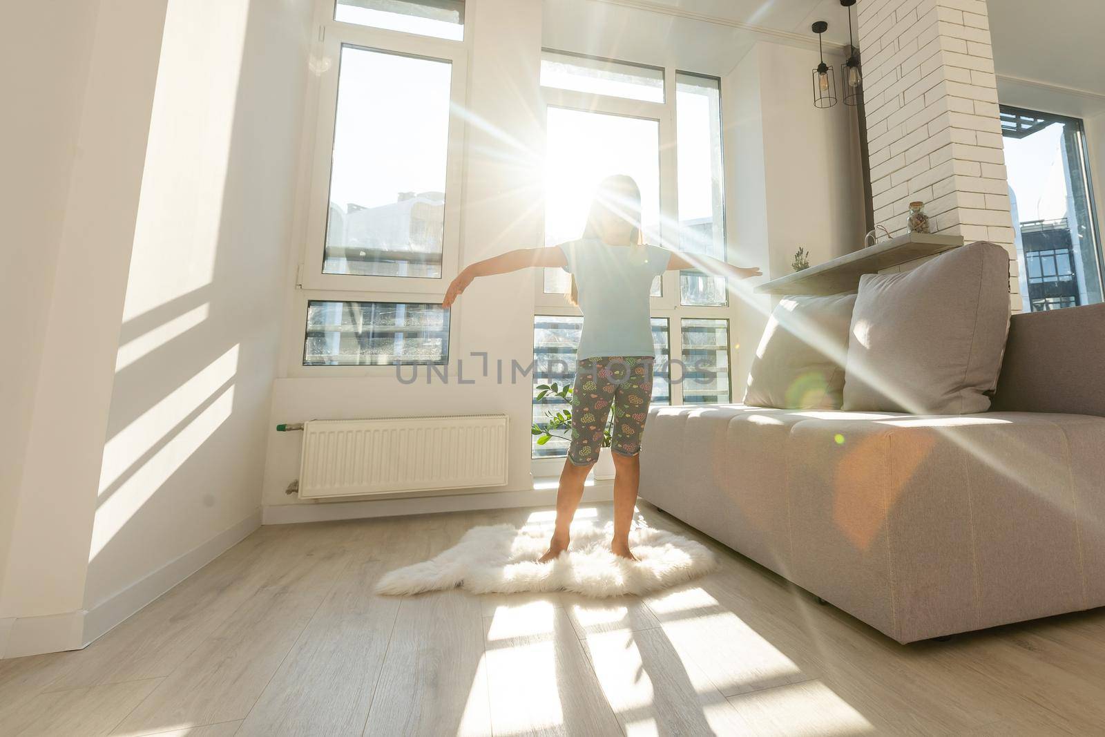 Moving concept. new apartment. happy child moving to new house. happy little girl