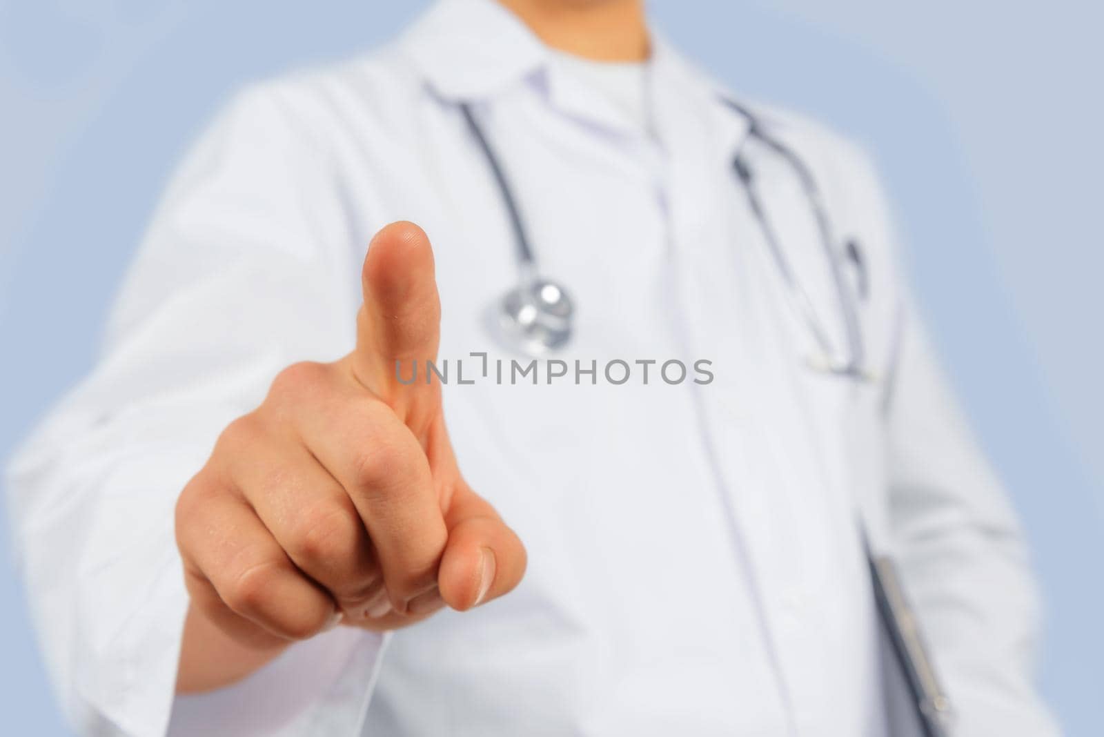Unrecognizable man doctor is touching something in the air, copyspace