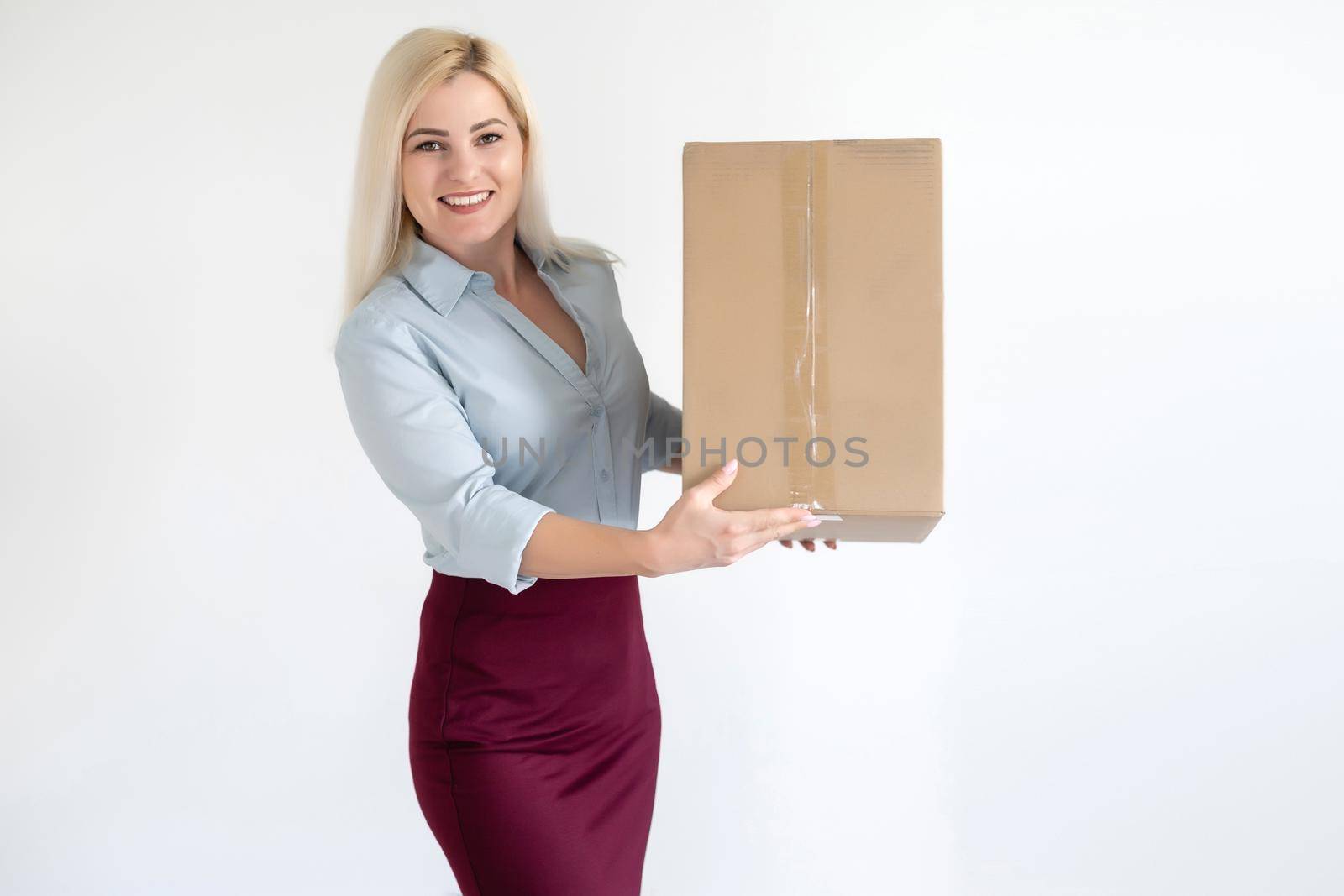 picture of attractive businesswoman delivering cardboard box