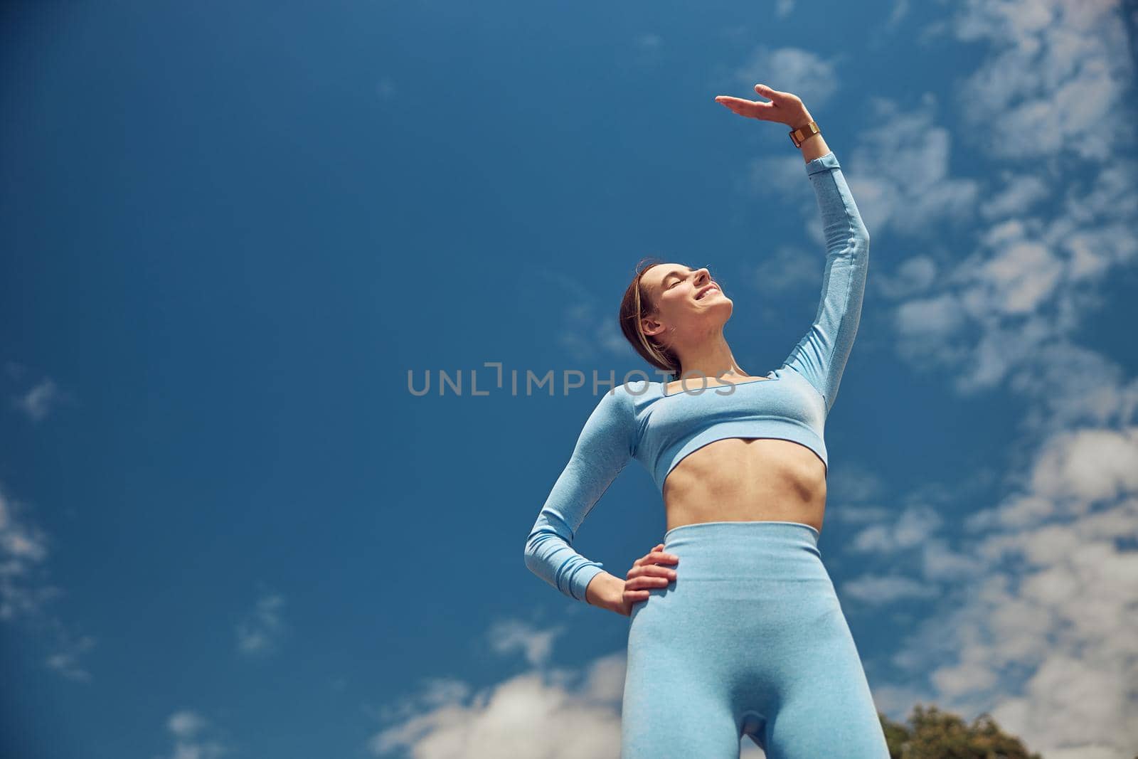 Beautiful fit young woman jogger is running outdoors by Yaroslav_astakhov