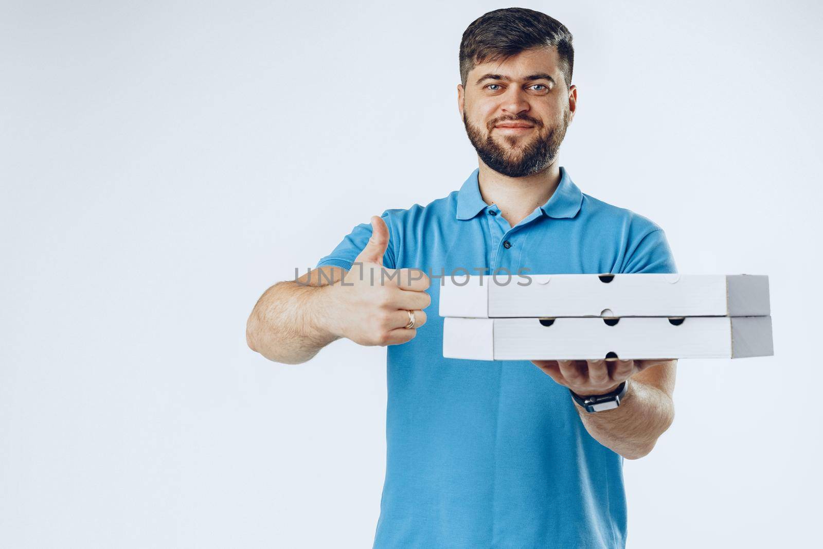 Food delivery courier with order on light grey background