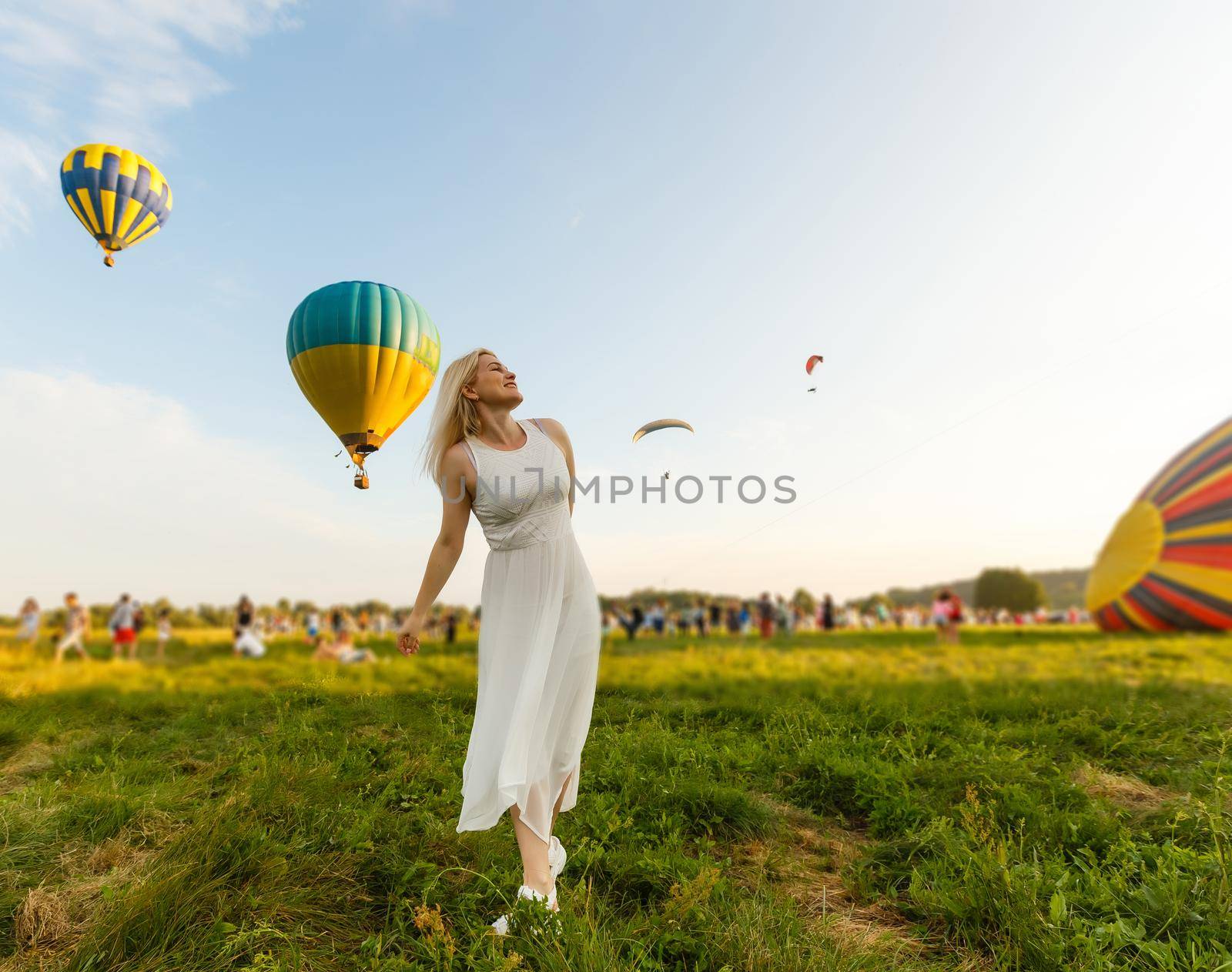 Amazing view with woman and air balloon. Artistic picture. Beauty world. The feeling of complete freedom