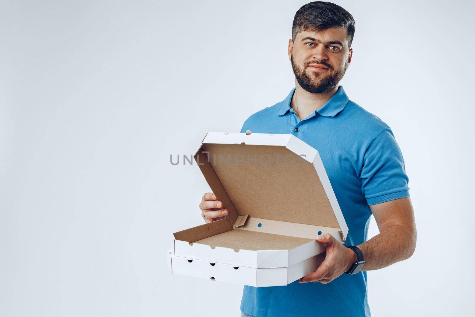 Food delivery courier with order on light grey background