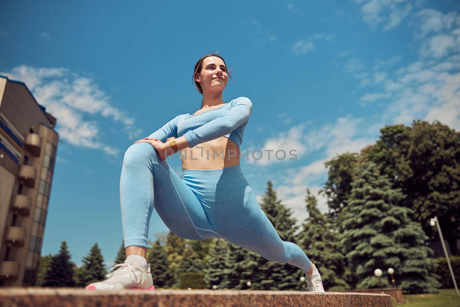 Beautiful fit young woman jogger is running outdoors