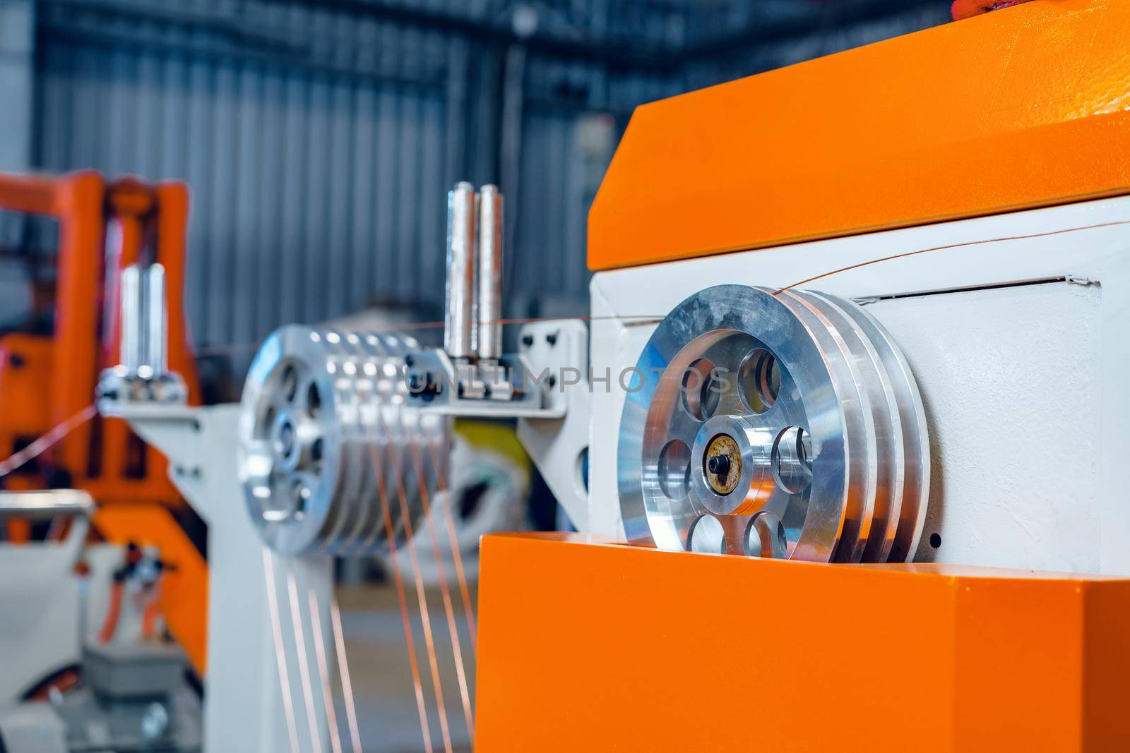 Cable production. Close up of a cable reel, manufacturing zone