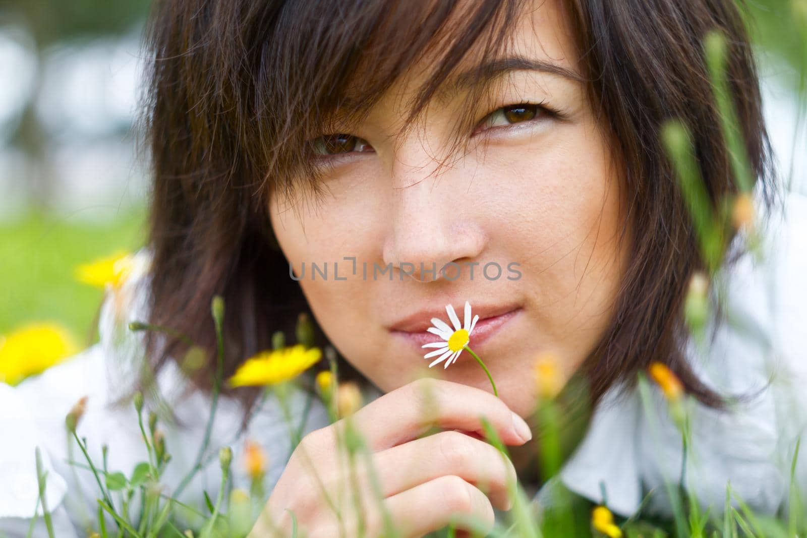 Portrait of a beautiful woman on nature, close-up