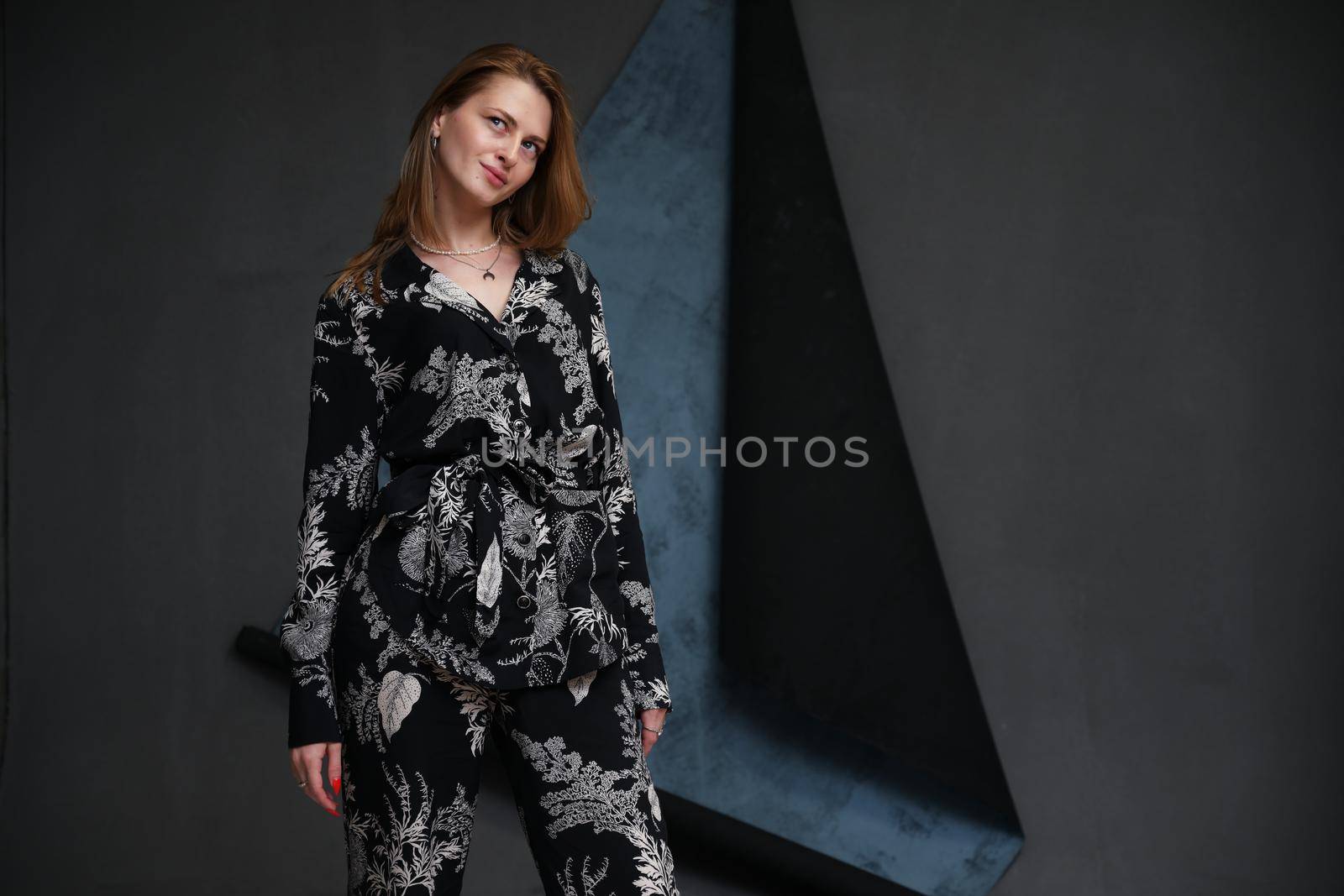 high resolution glamorous photo girl model stands on dark background in studio by chichaevstudio