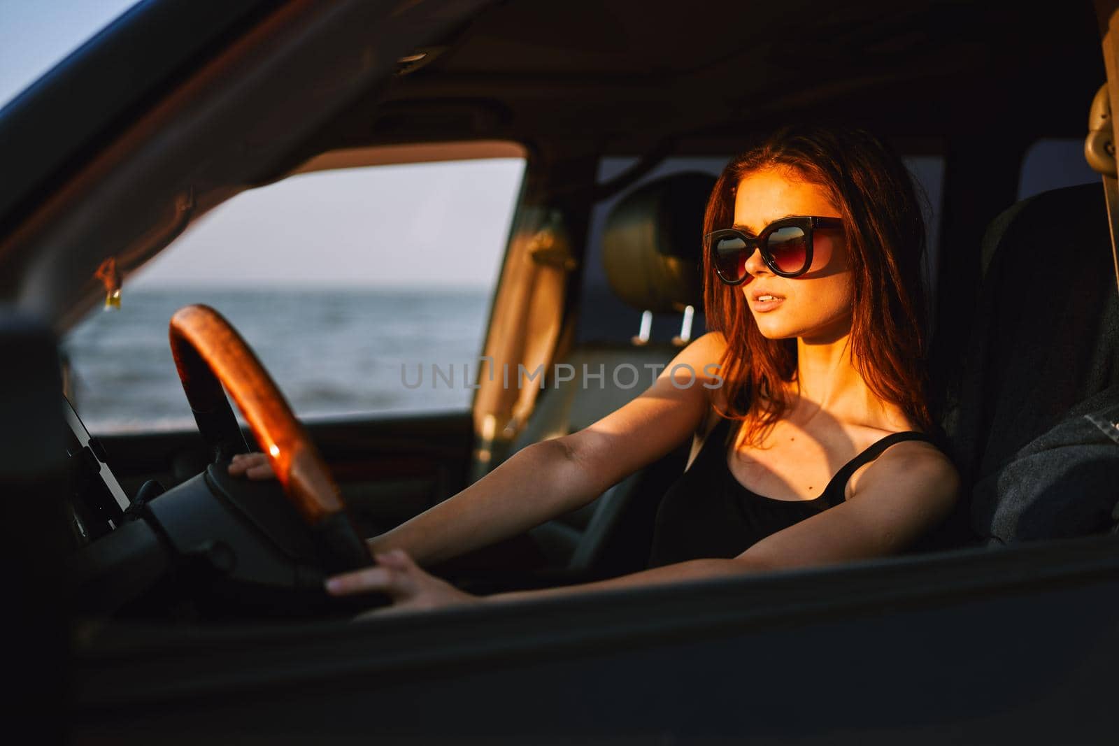 woman driving in car trip posing fashion travel. High quality photo