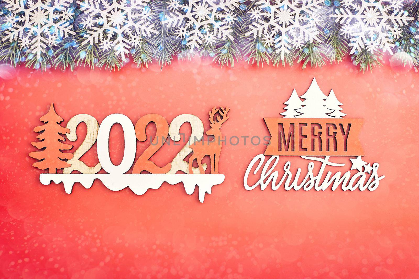 Sparkle bokeh lights on red canvas background. Merry christmas card. Winter holiday theme. Happy New Year.