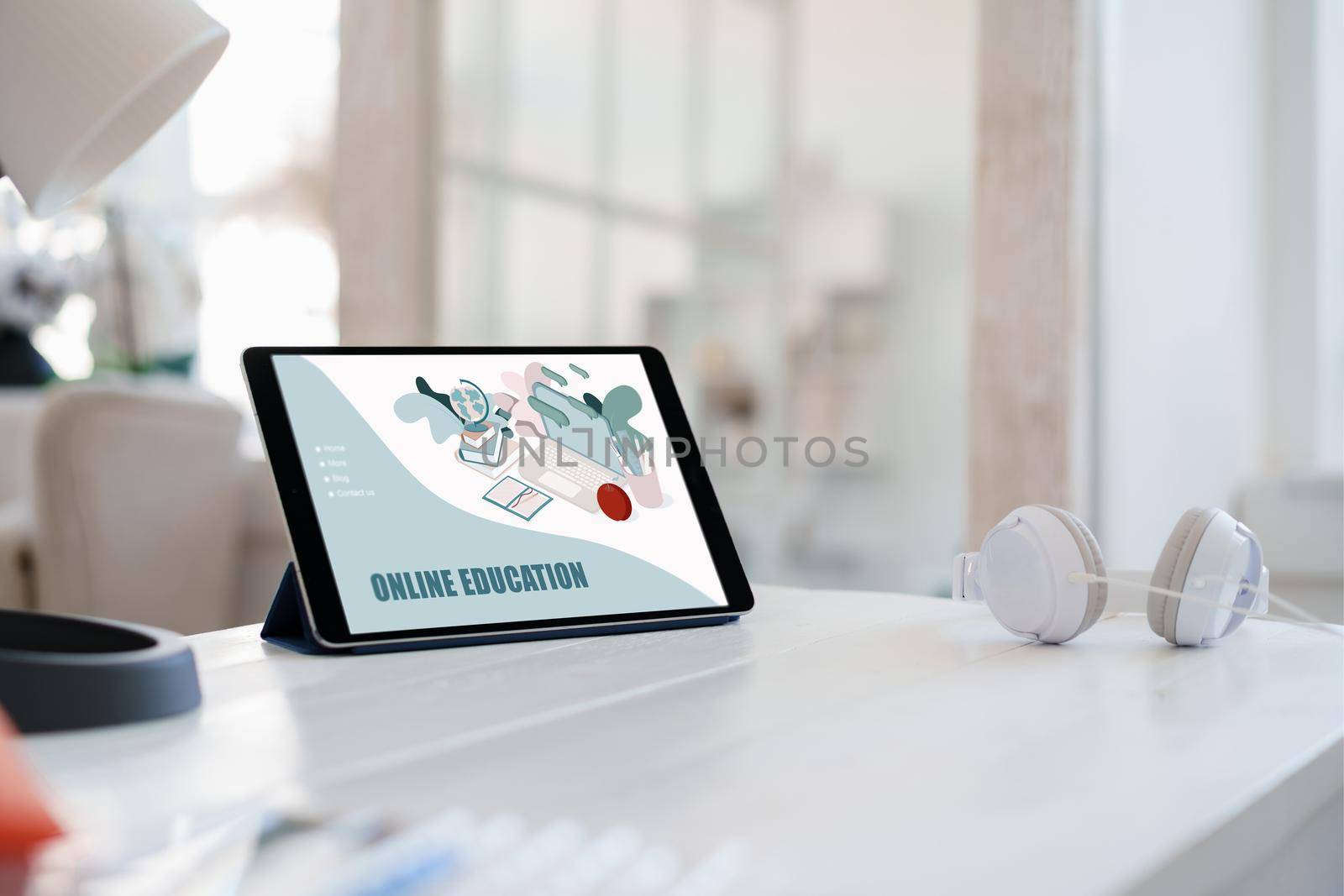 E-learning on digital tablet on white wooden table, close up