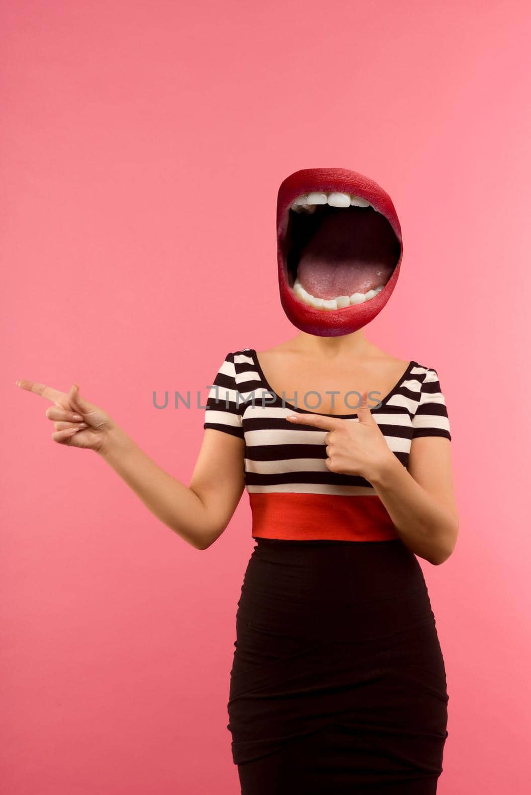 Stylish fashion sexy bad crazy girl with an open mouth instead of a head. Red lips .Pointing a side. Pink background