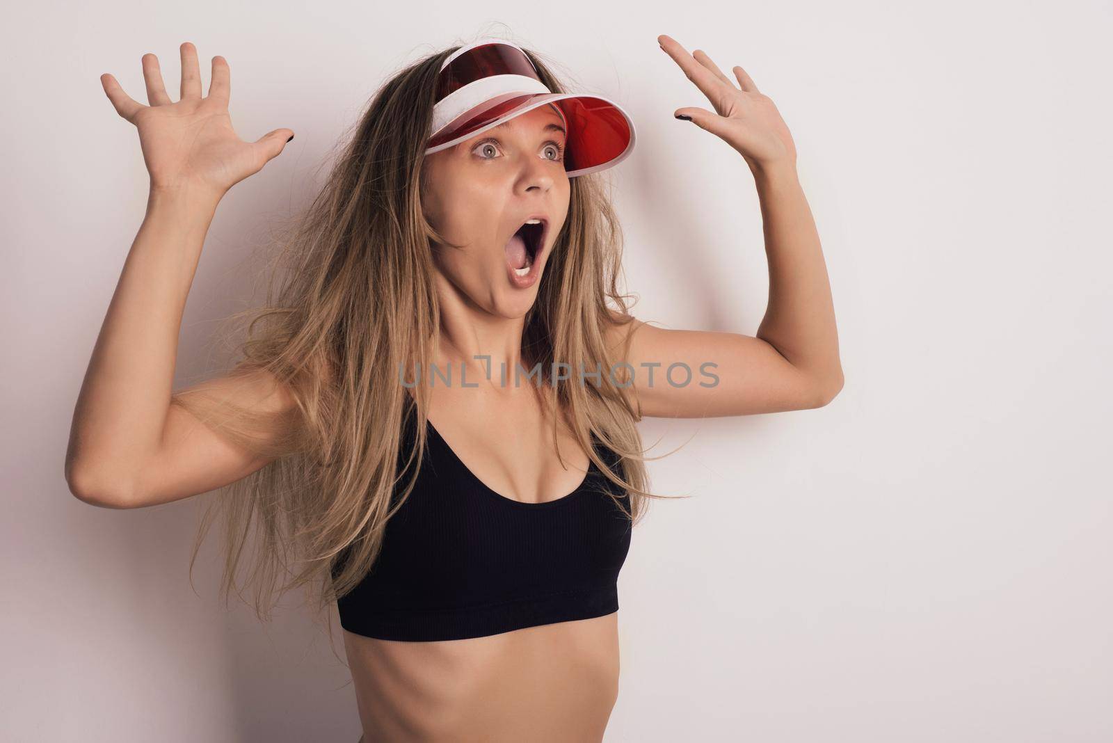 Portrait of young pretty blonde surprised woman on white background - Image