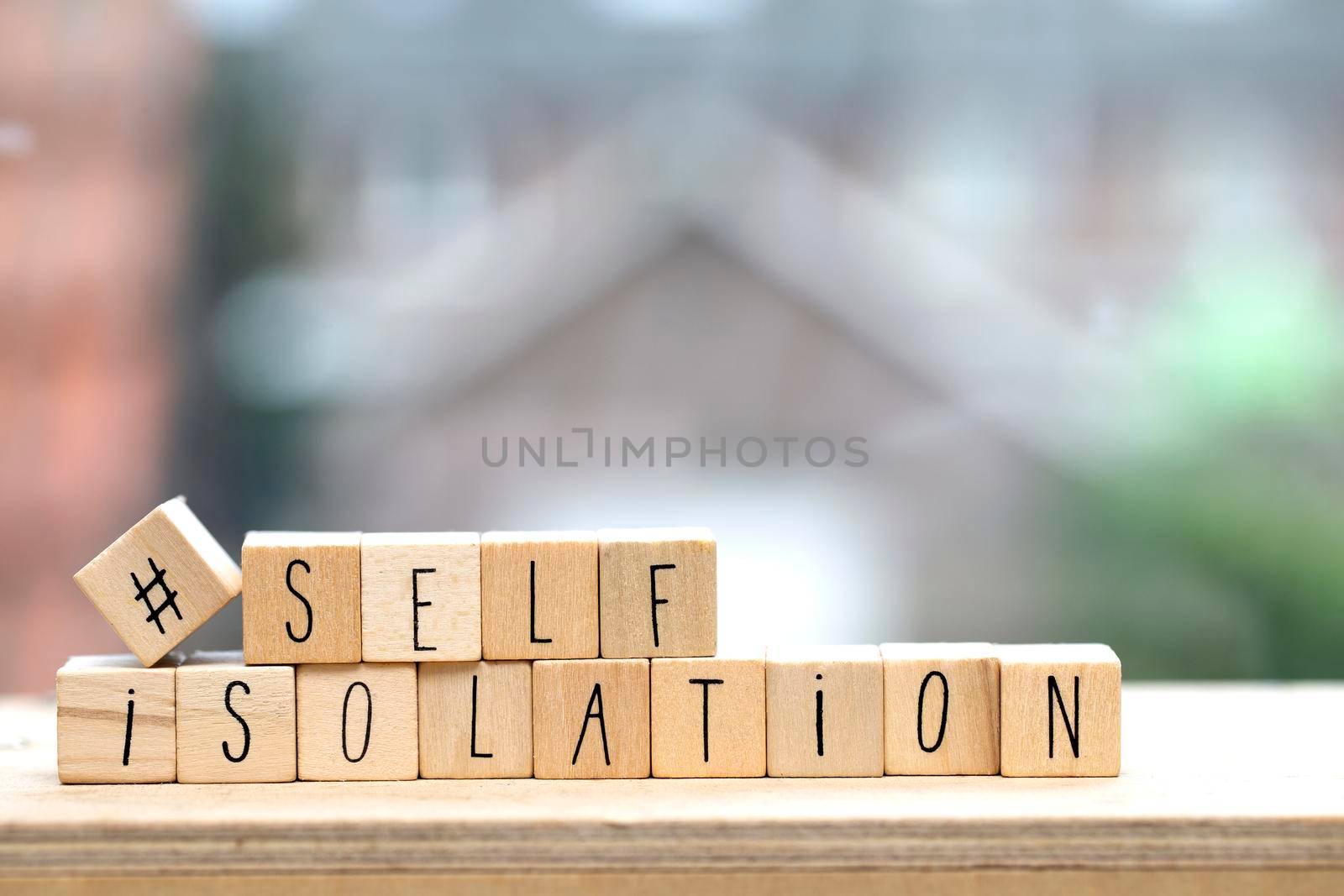 Wooden cubes with the word Self isolation and a question mark for Covid-19, coronavirus needs quarantine concept. virus