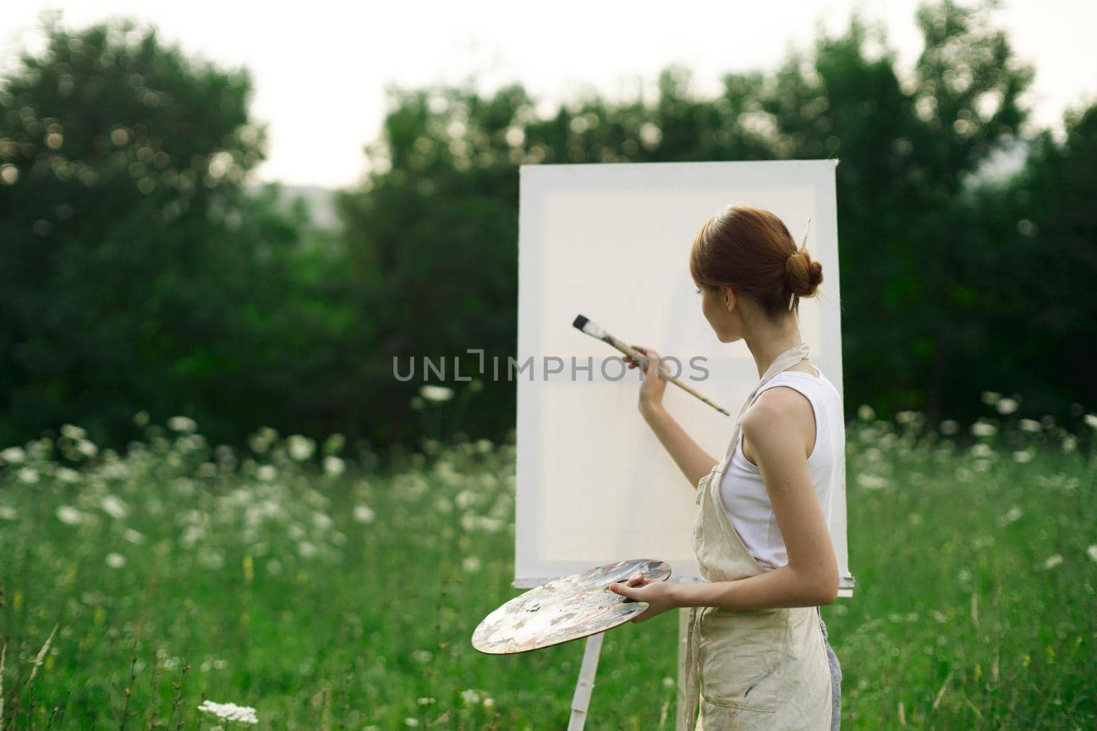 woman artist outdoors easel drawing creative landscape by Vichizh