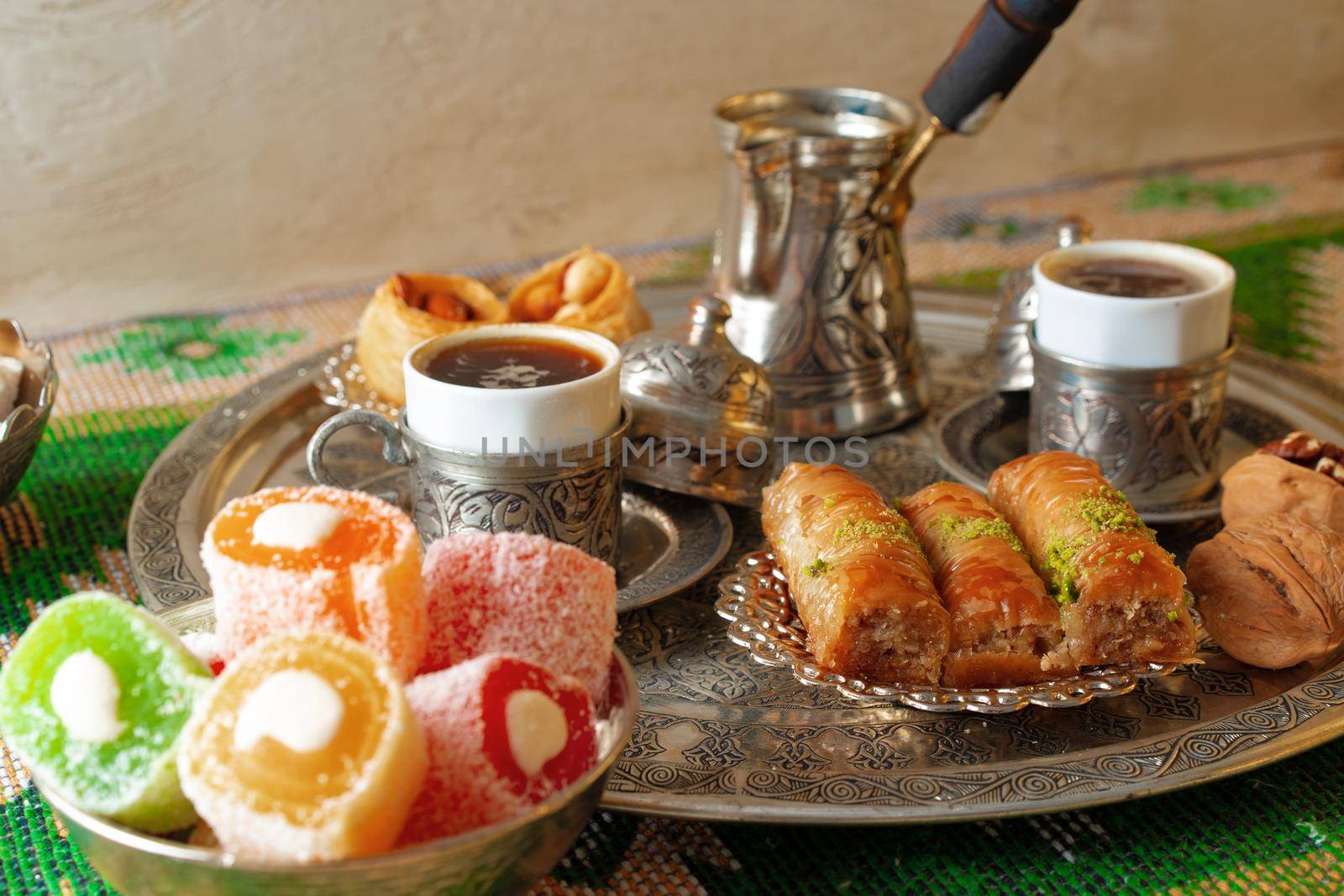 Turkish Coffee served with Turkish Delight on metal tray, close up