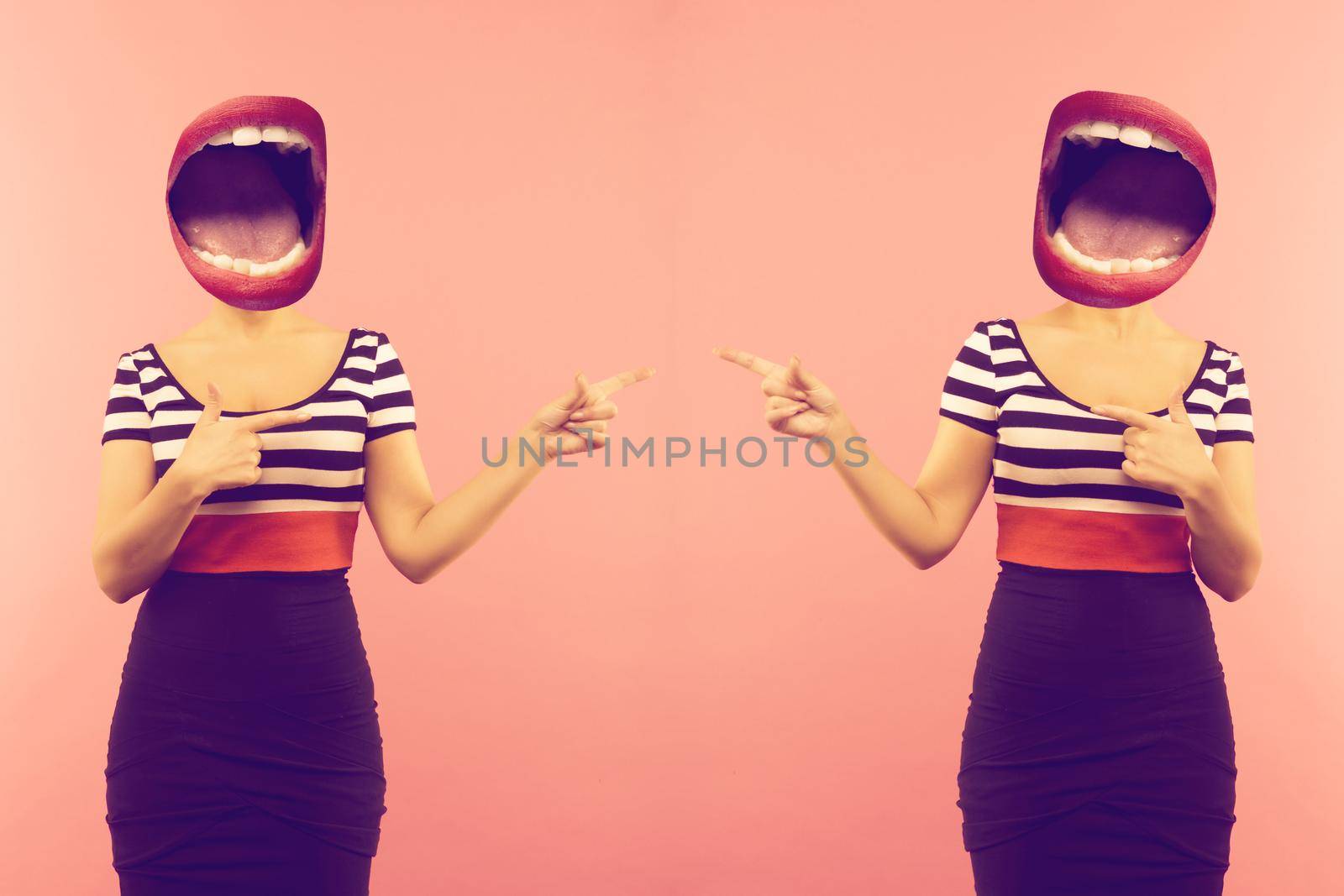 Stylish fashion sexy bad crazy girl with an open mouth instead of a head. Red lips .Two woman pointing a side. Pink background