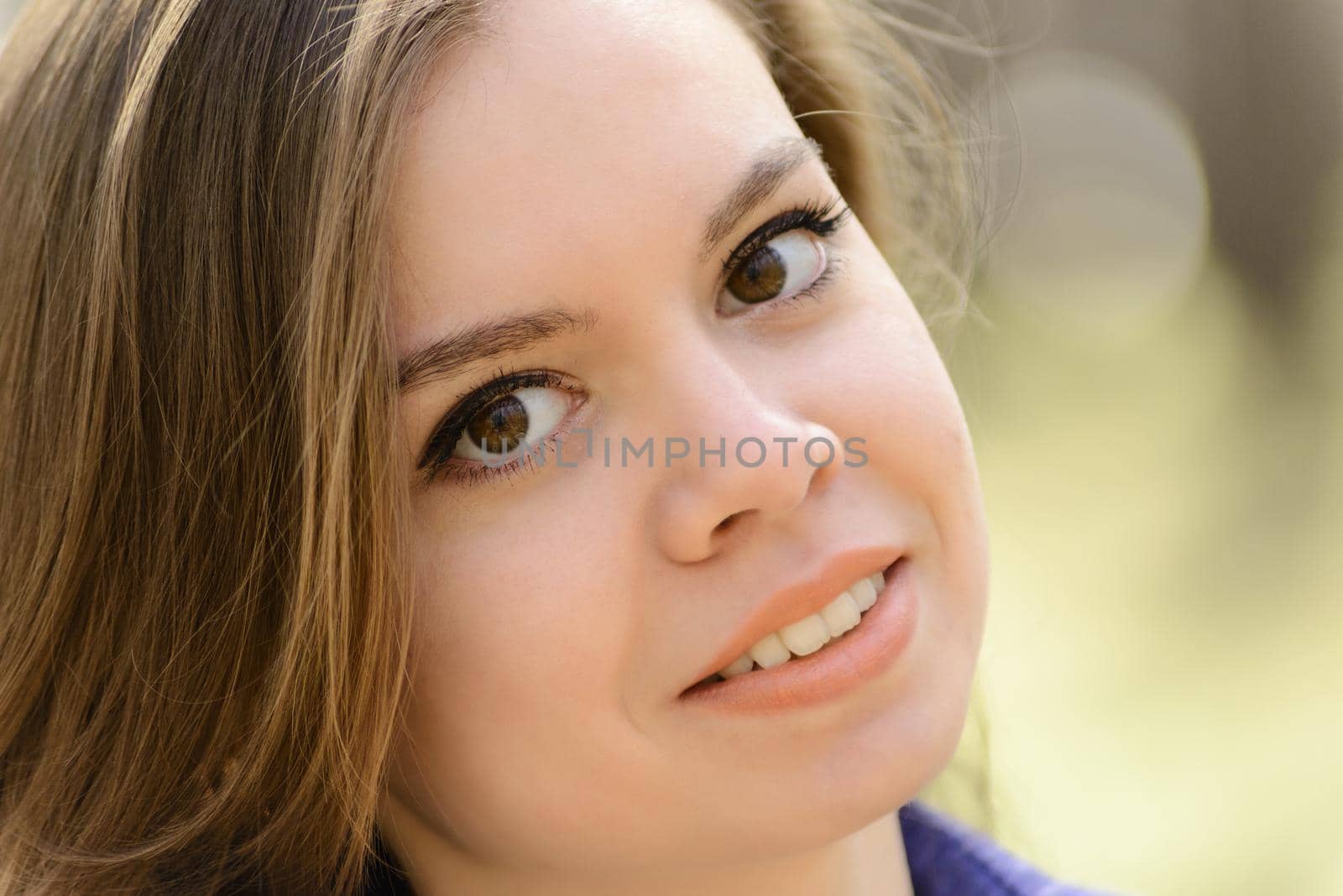 Closeup sensual portrait of beautiful girl outdoors.