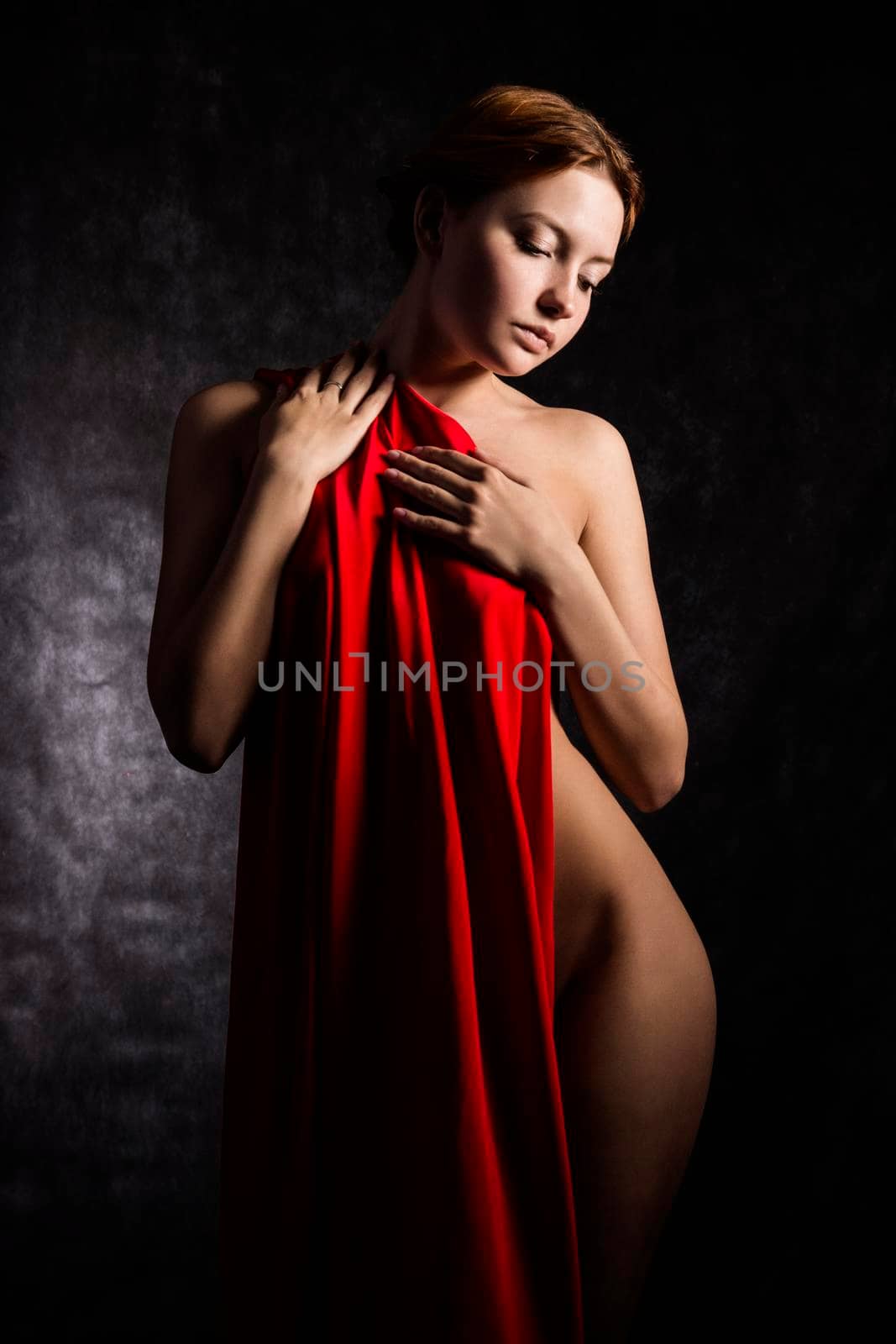 Beautiful woman with red tissue around her waist by zartarn