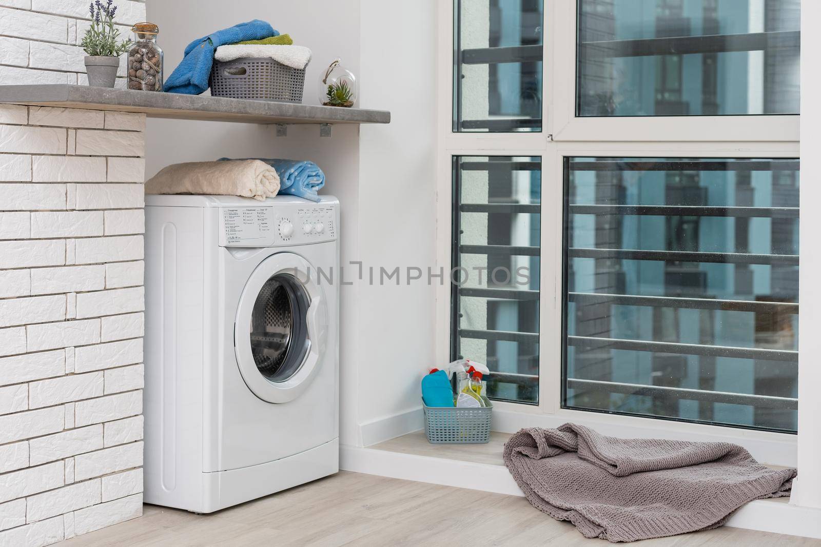 Contemporary luxury laundry in a brand new apartment in white.