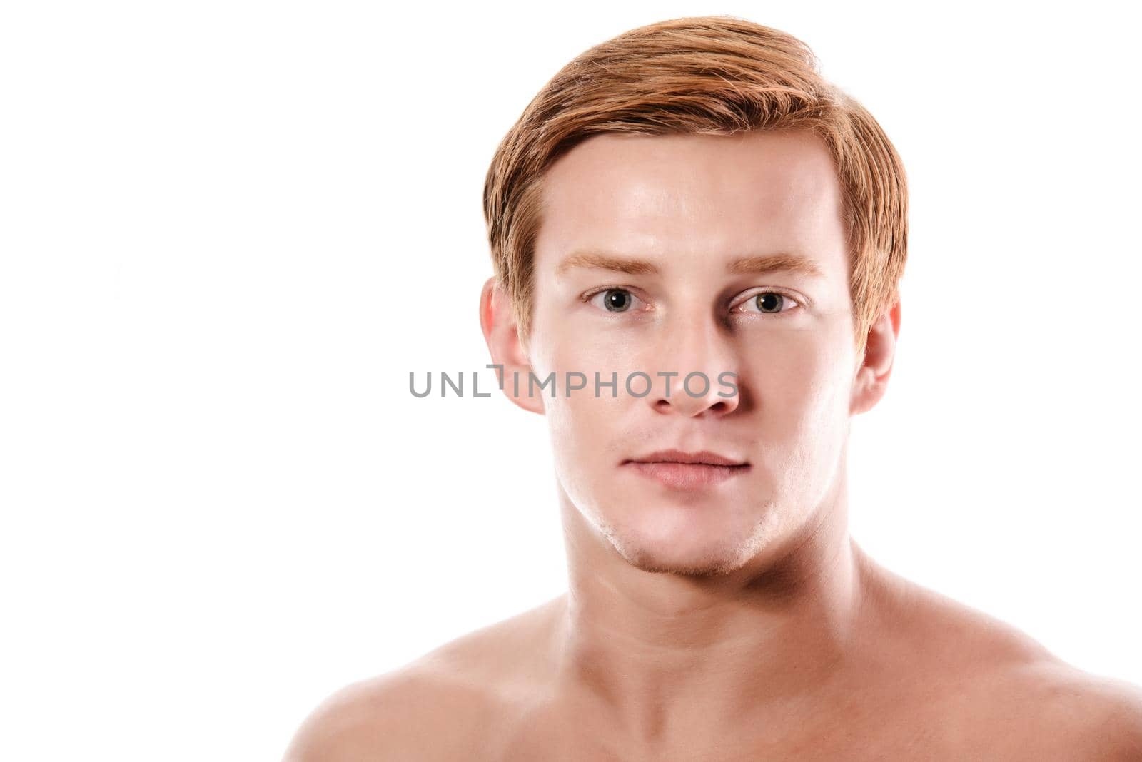 Portrait of a beautiful friendly young blond man.