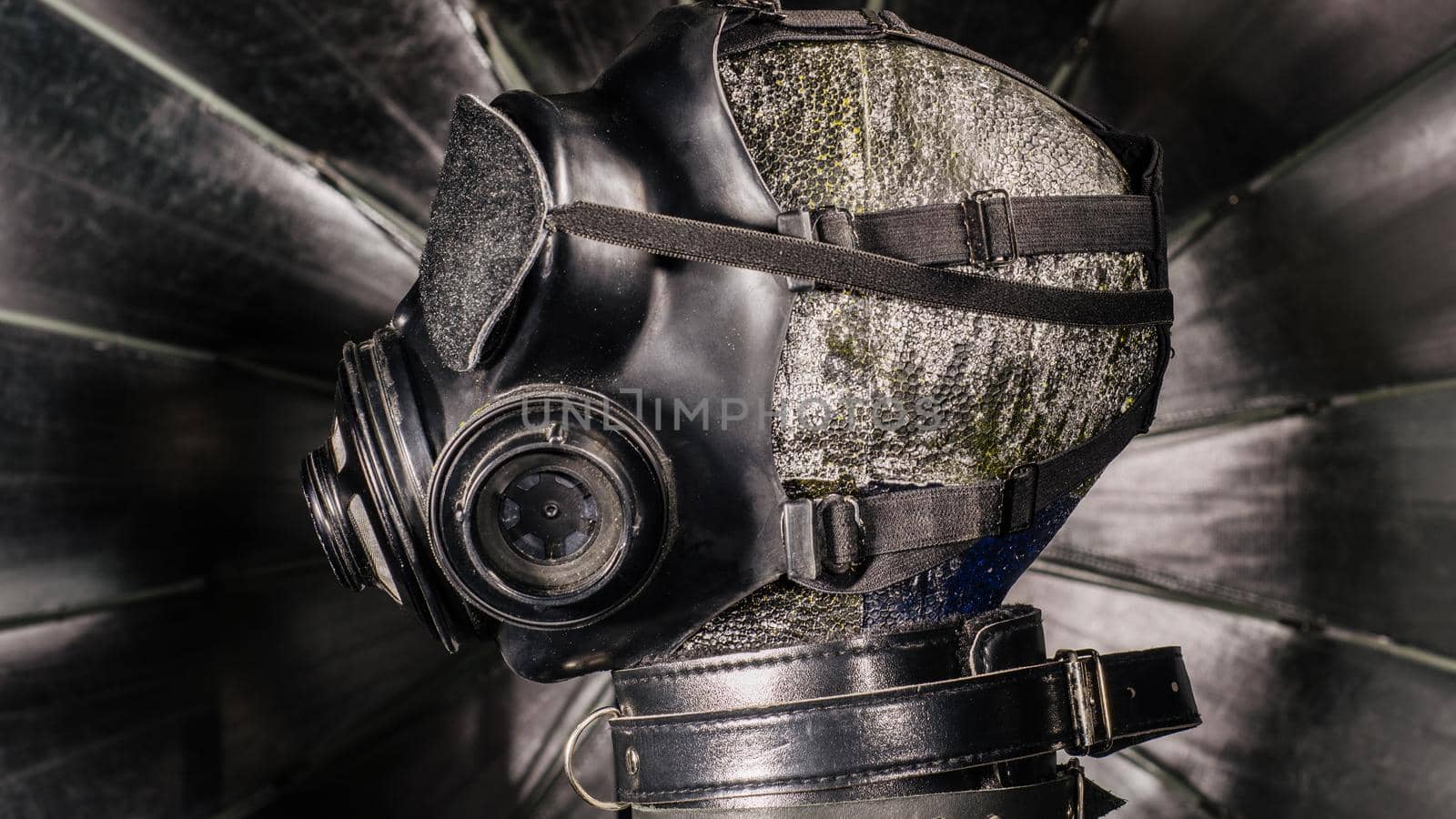 Close up bdsm outfit. Bondage, kinky adult sex games, kink and BDSM lifestyle concept with gas maskon the mannequin head.