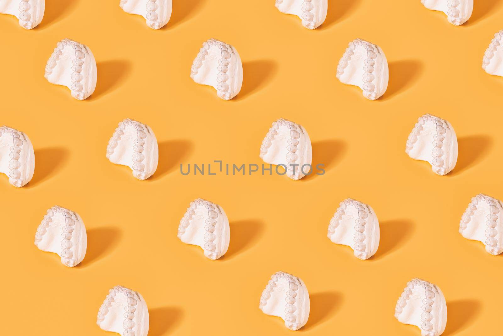 Minimal  concept.Trendy braces pattern made with various  braces on bright light yellow background.