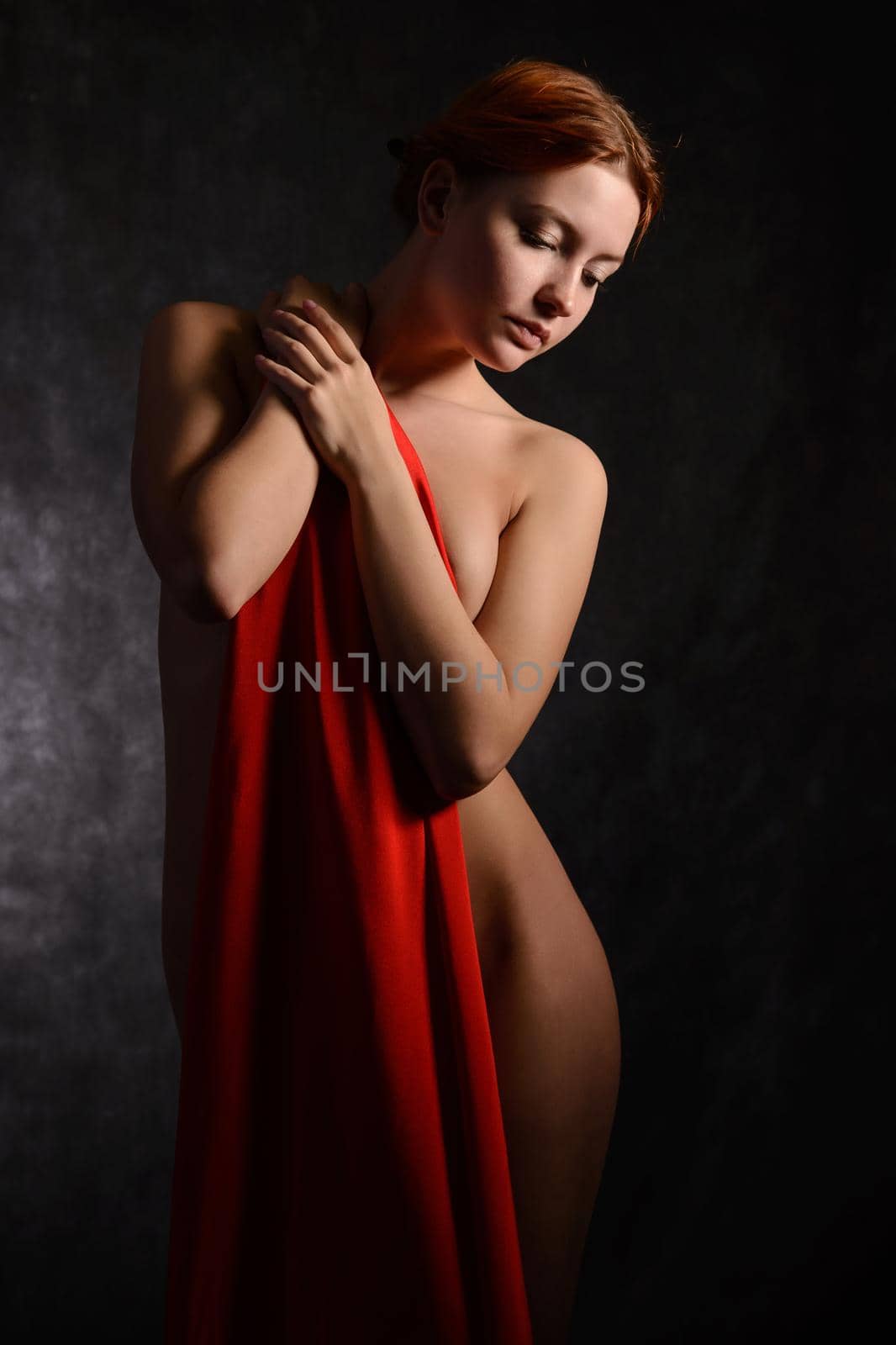 Beautiful woman with red tissue around her waist