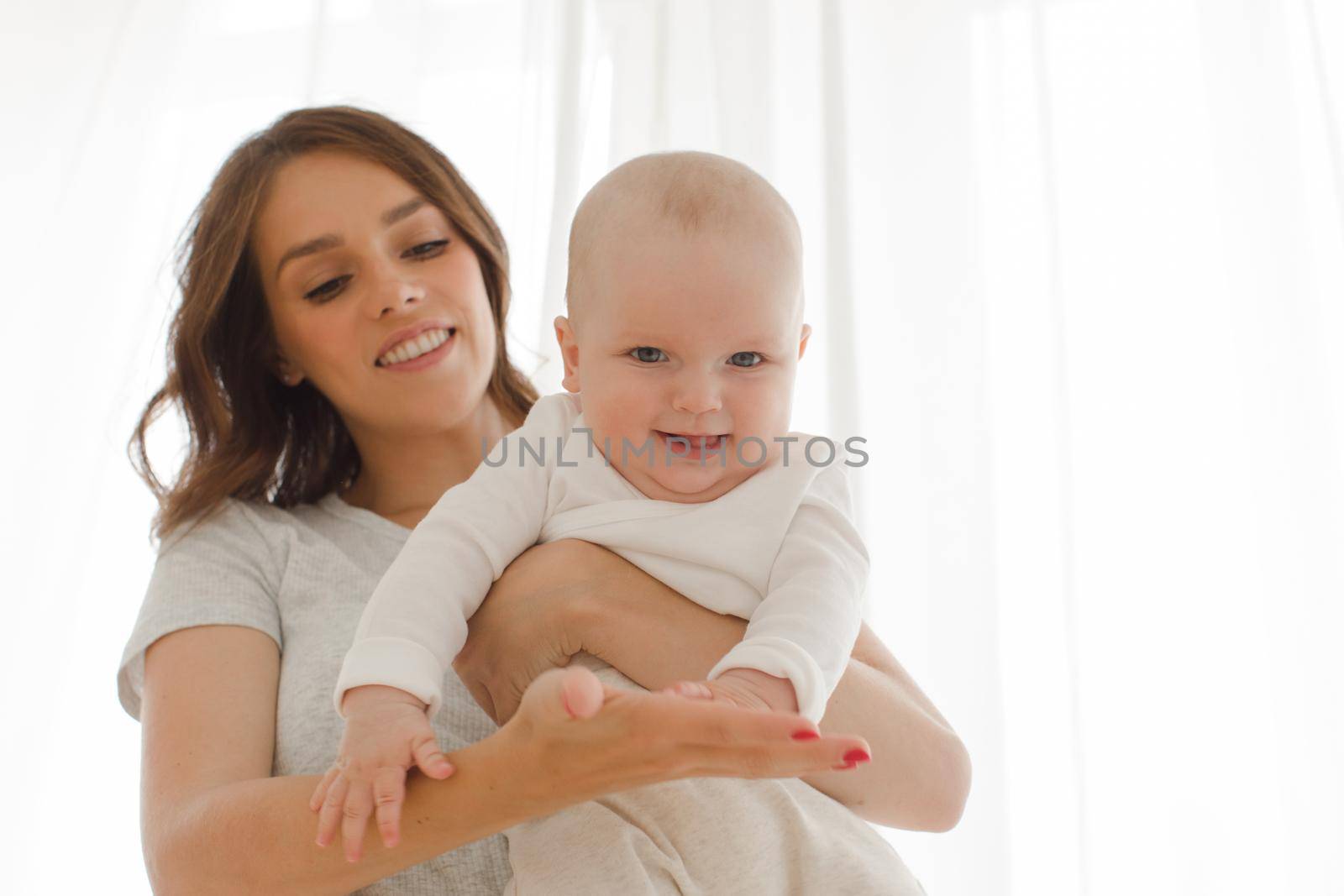 Woman playing with infant child by Demkat
