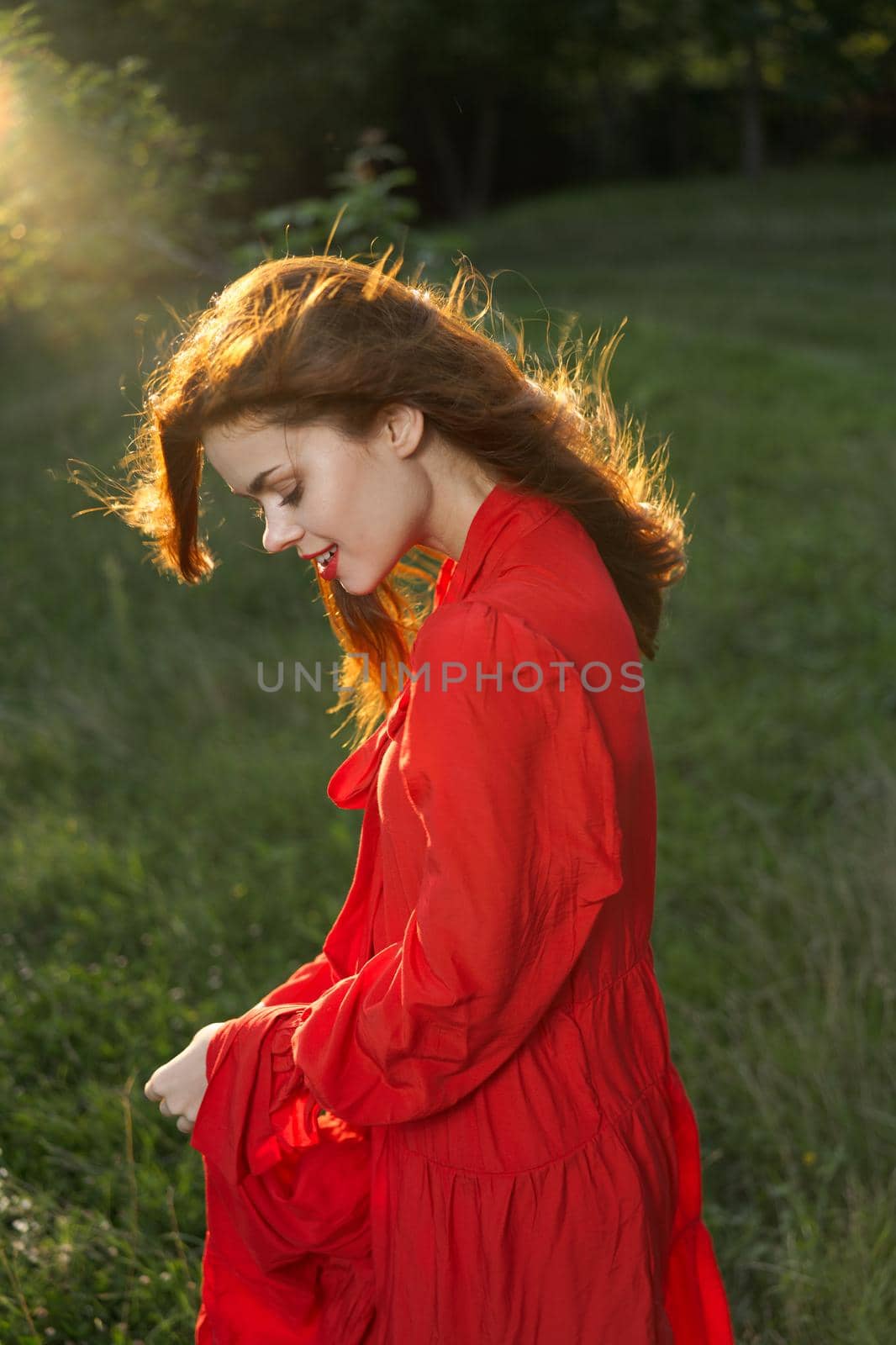 woman in red dress posing nature sun fun by Vichizh