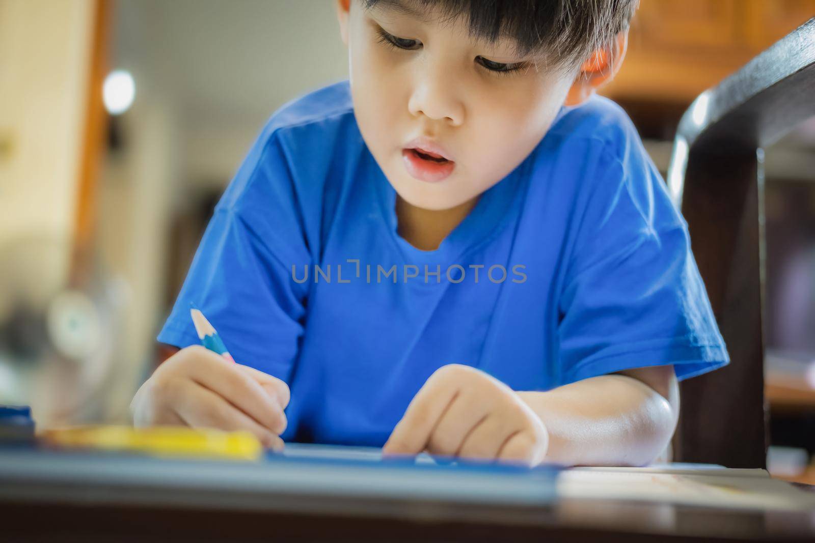 kindergarten children coloring their homework to the teacher. by Manastrong