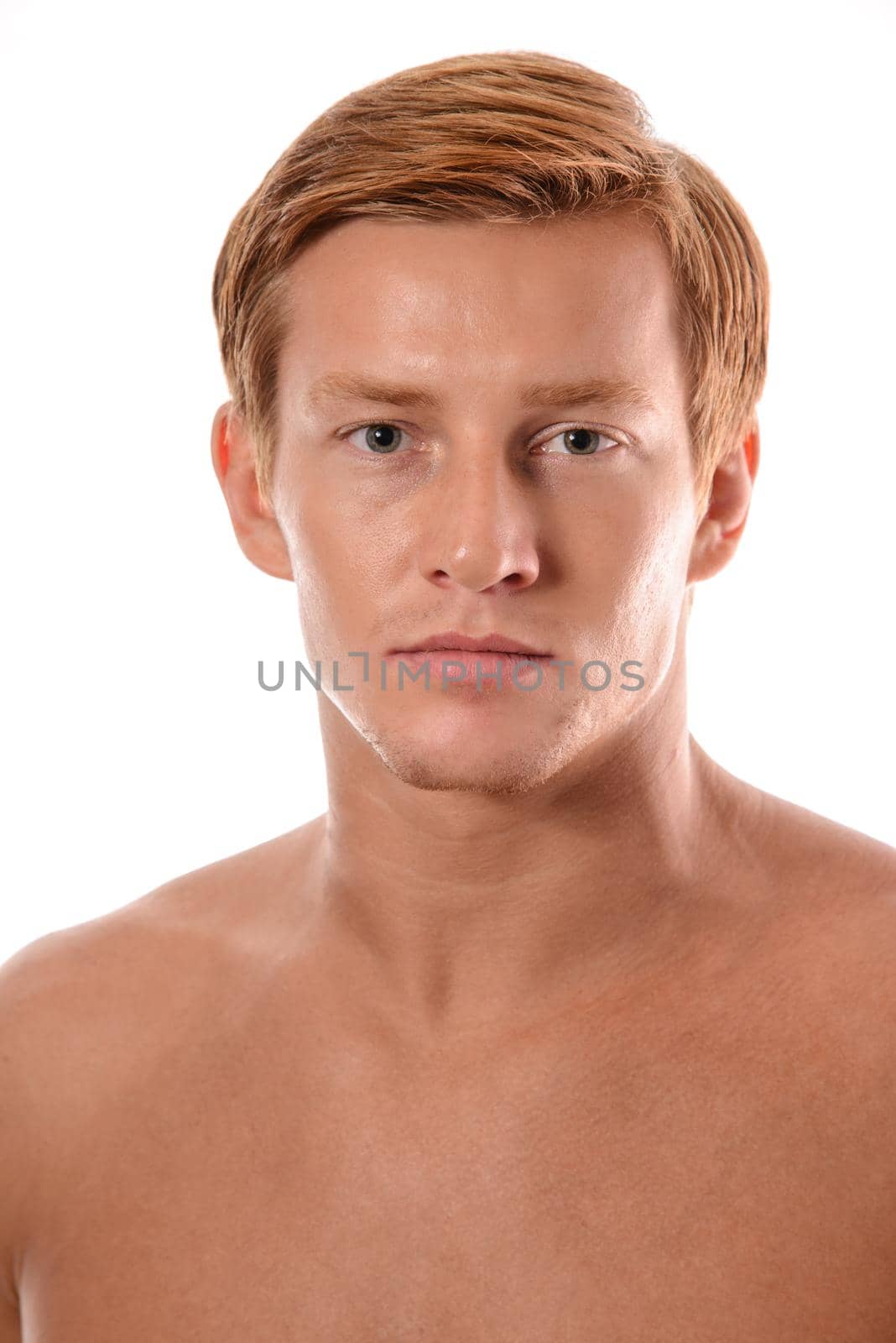 Handsome young man portrait isolated on white background. Muscular teenage guy portrait. Teenager boy face closeup