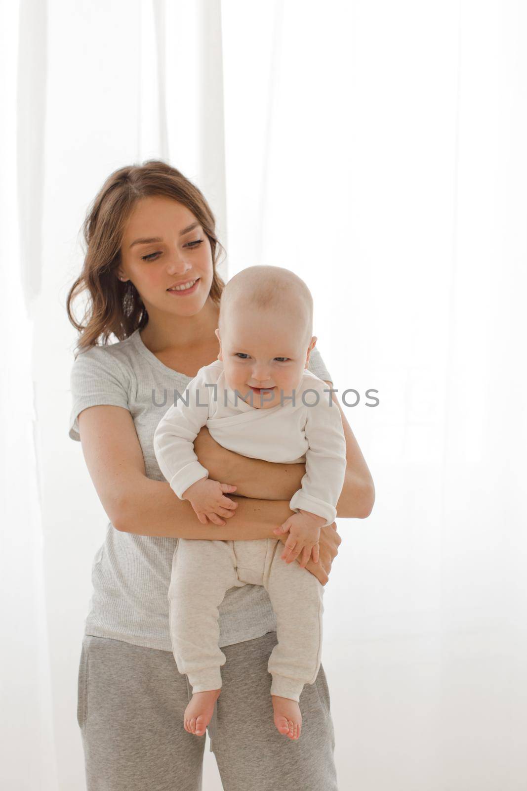 Woman playing with infant child by Demkat