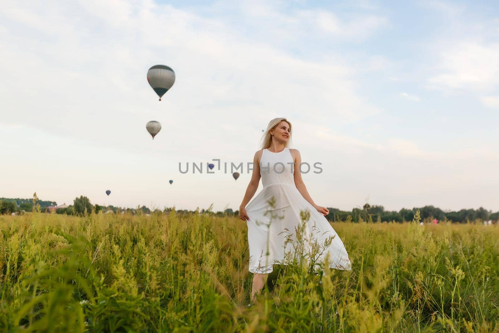 A tourist woman enjoying wonderful view of the balloons. Happy Travel concept