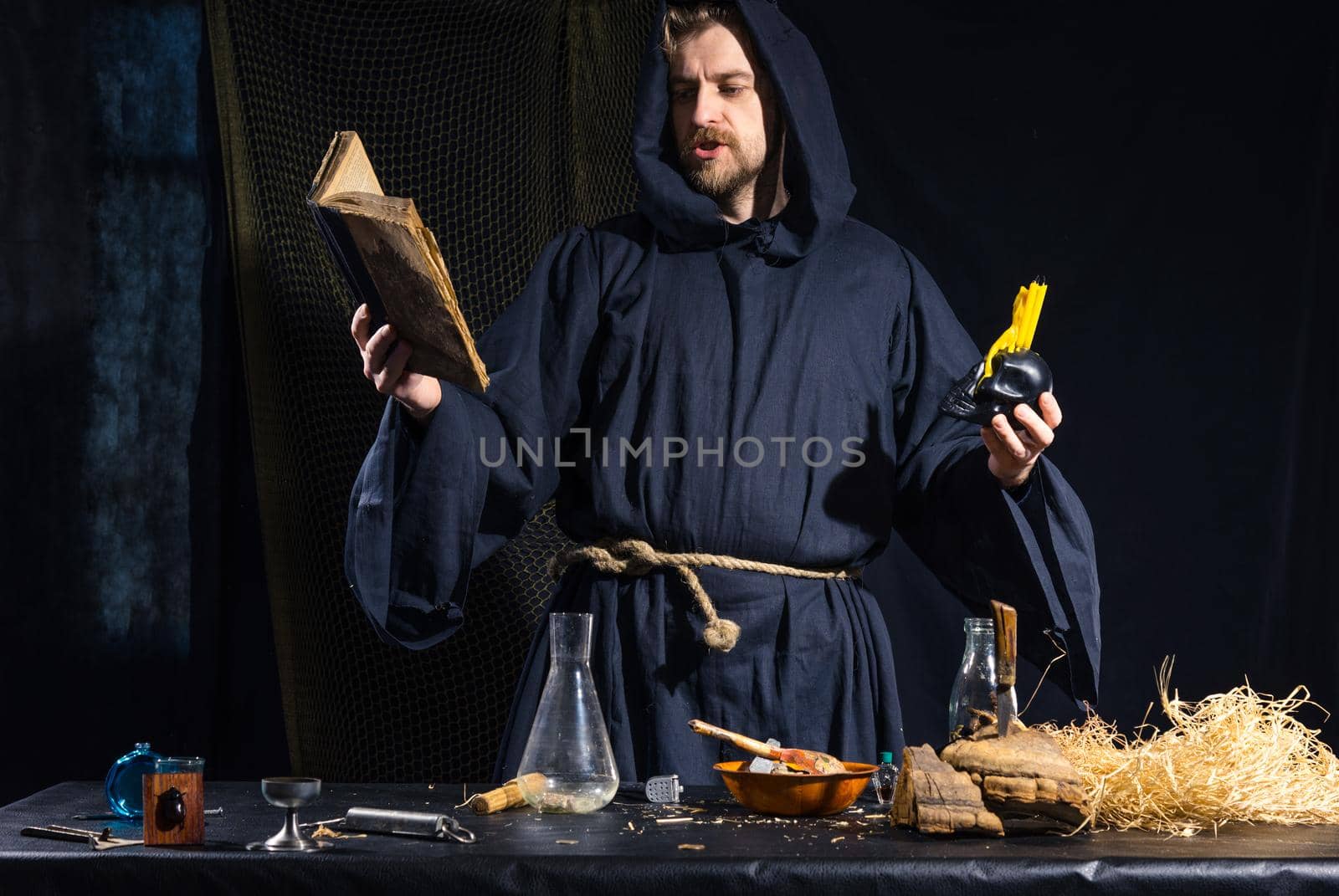 Portrait of a crazy medieval scientist working in his laboratory. by zartarn