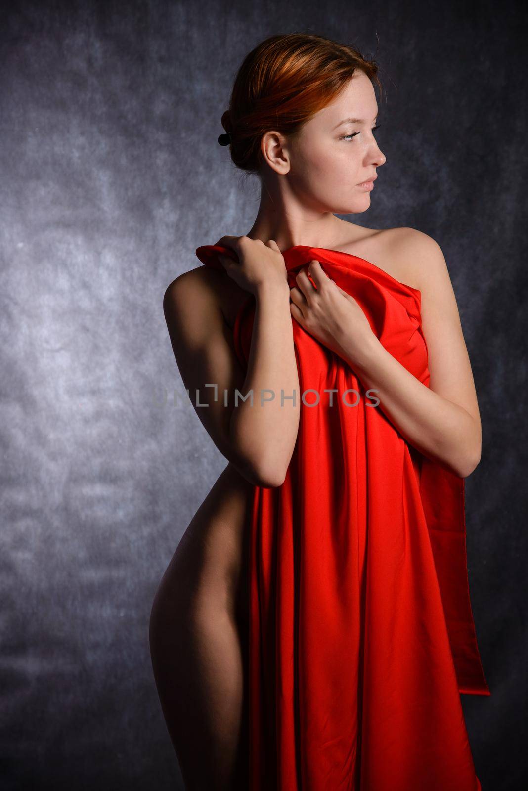 Beautiful woman with red tissue around her waist