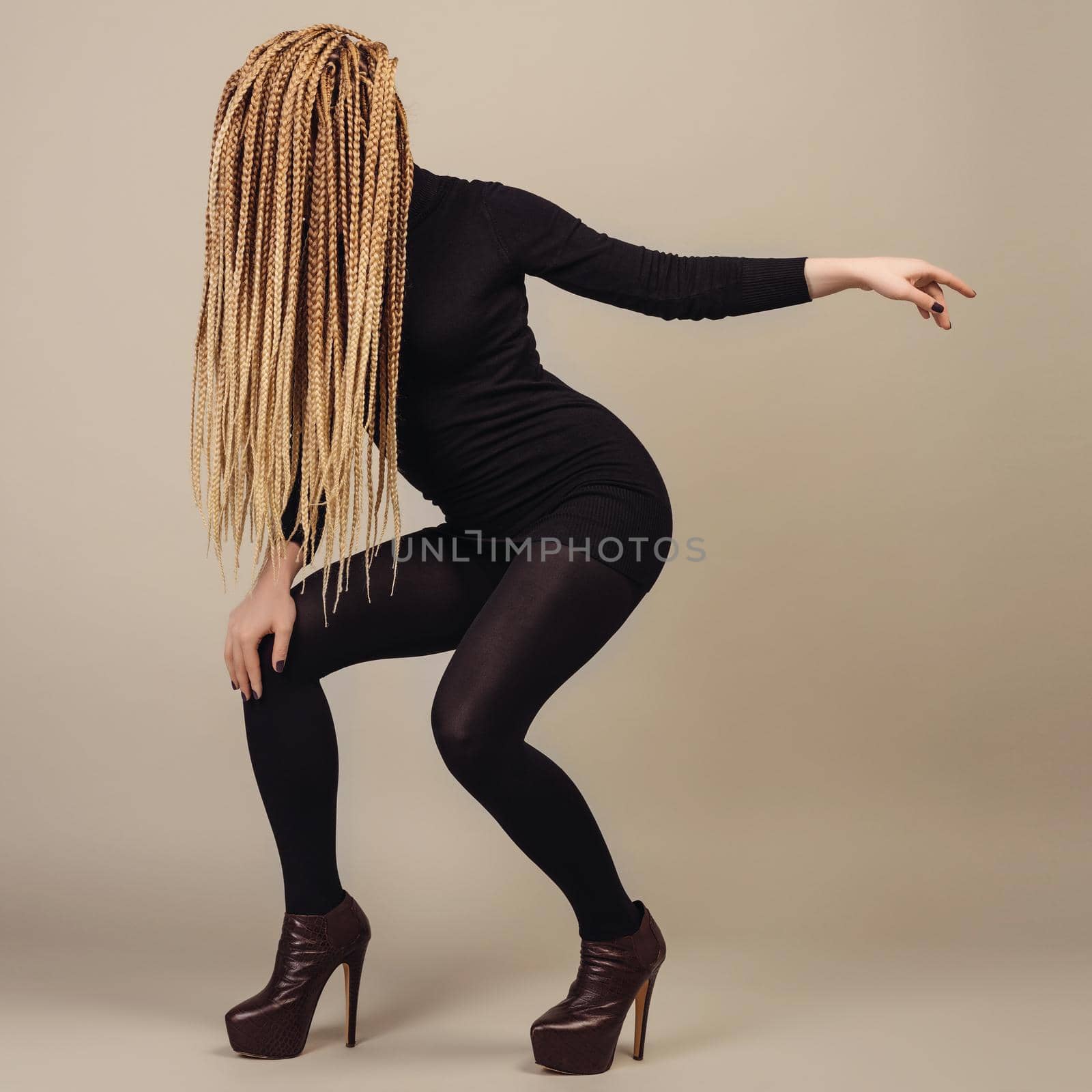 Messages and new information concept. Young blonde casual woman covering her face by hair. Girl showing presenting copy space.