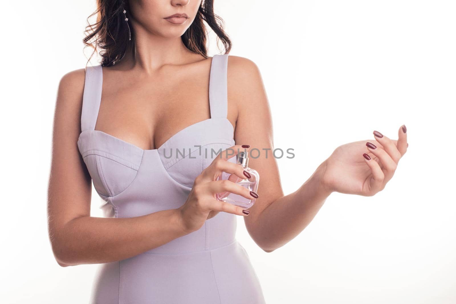 hands and perfume, beautiful gentle female hands, pink jar of perfume, lace sleeves