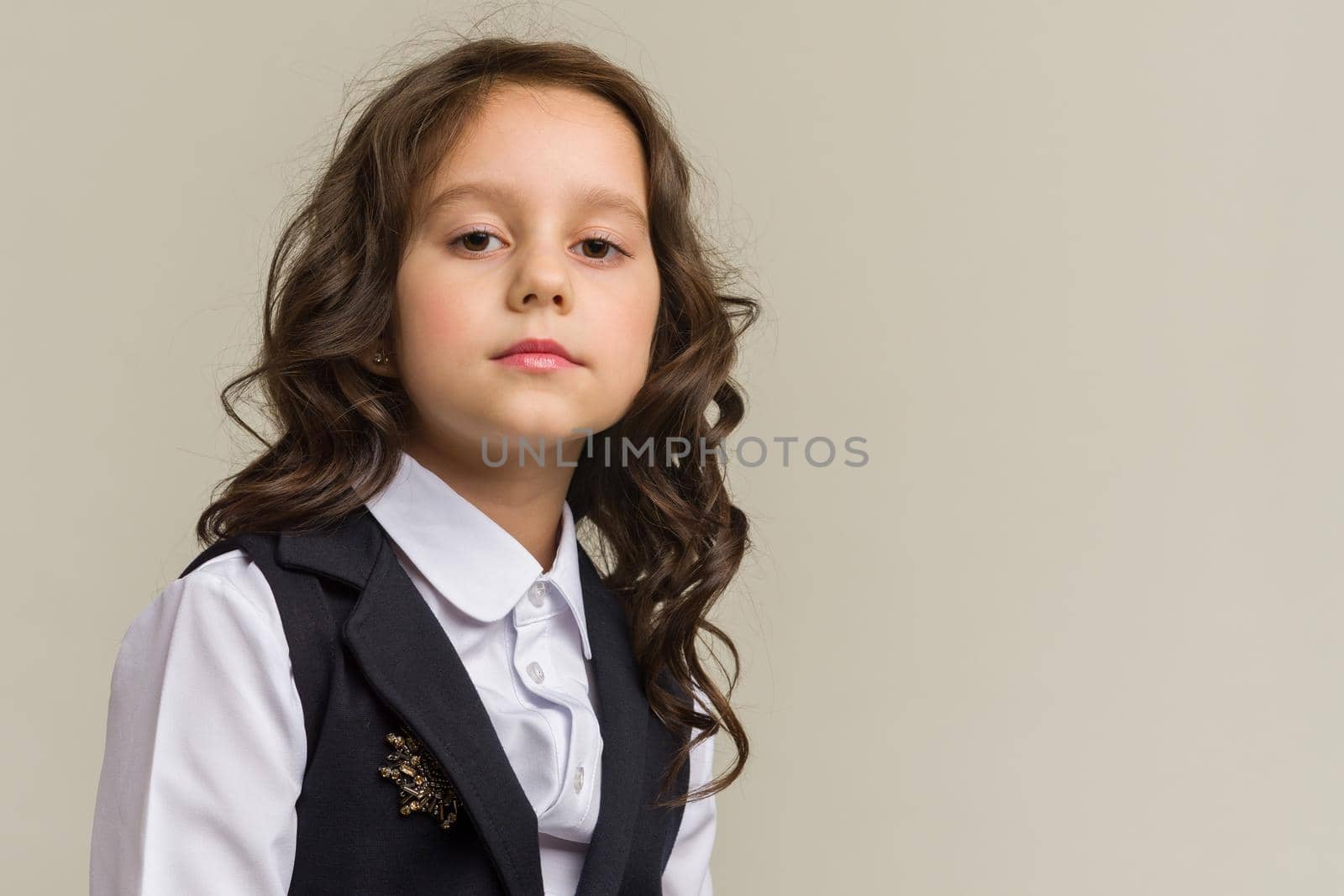 Photo of smiling little girl child isolated over grey background. by zartarn