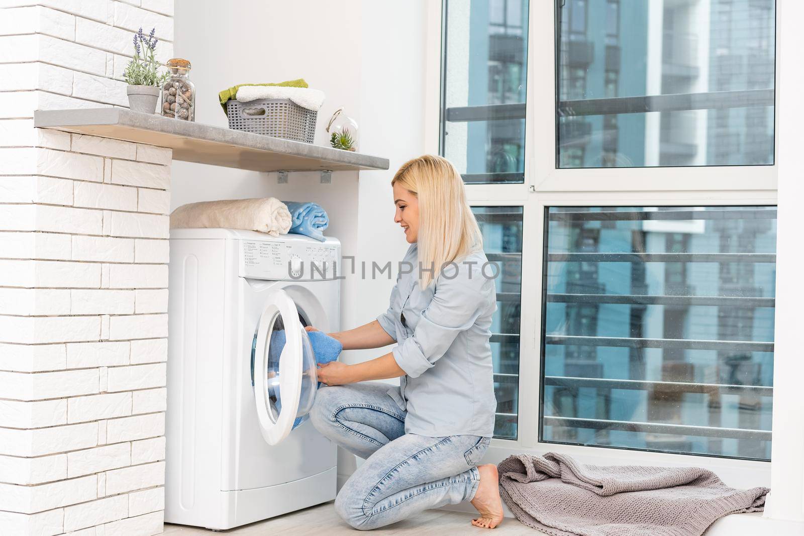 pretty smiling girl in the laundry room
