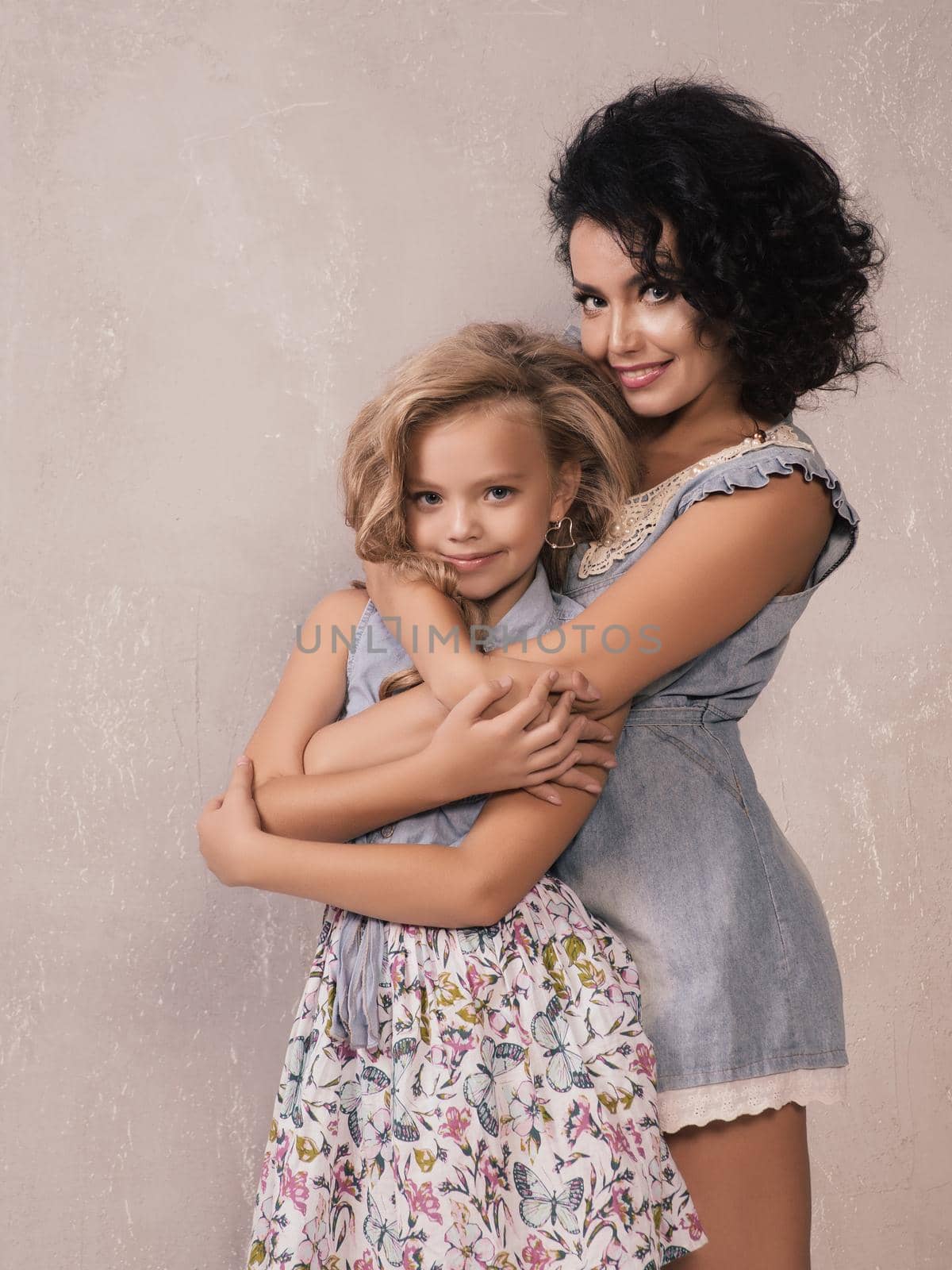 Caucasian cute mother hugging daughter , love and happy concept by zartarn