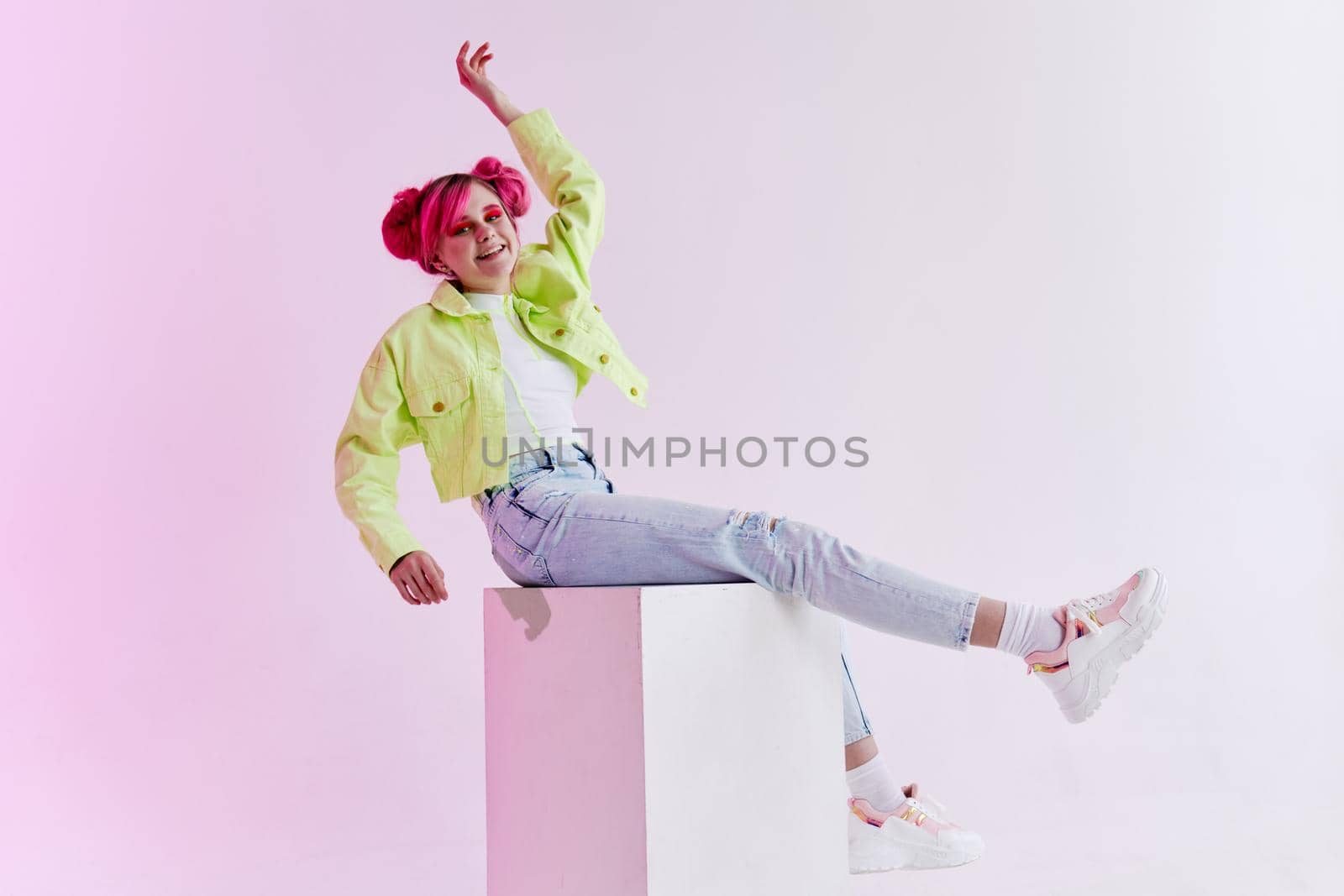 fashionable woman with pink hair creative studio model. High quality photo