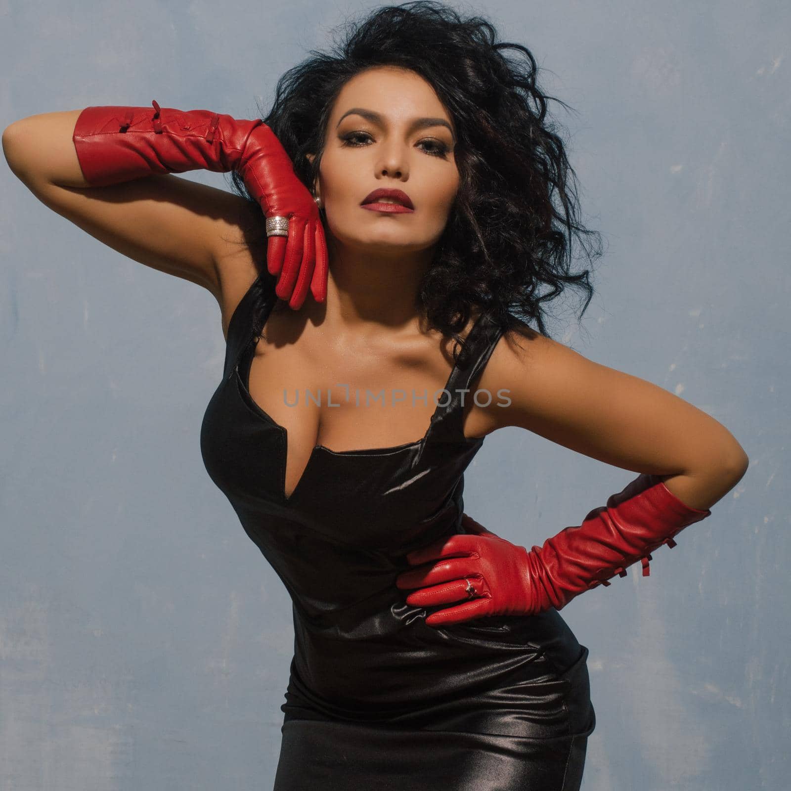 Luxurious Asian woman posing in black leather dress and red gloves. Dominant Fetish Lady. by zartarn
