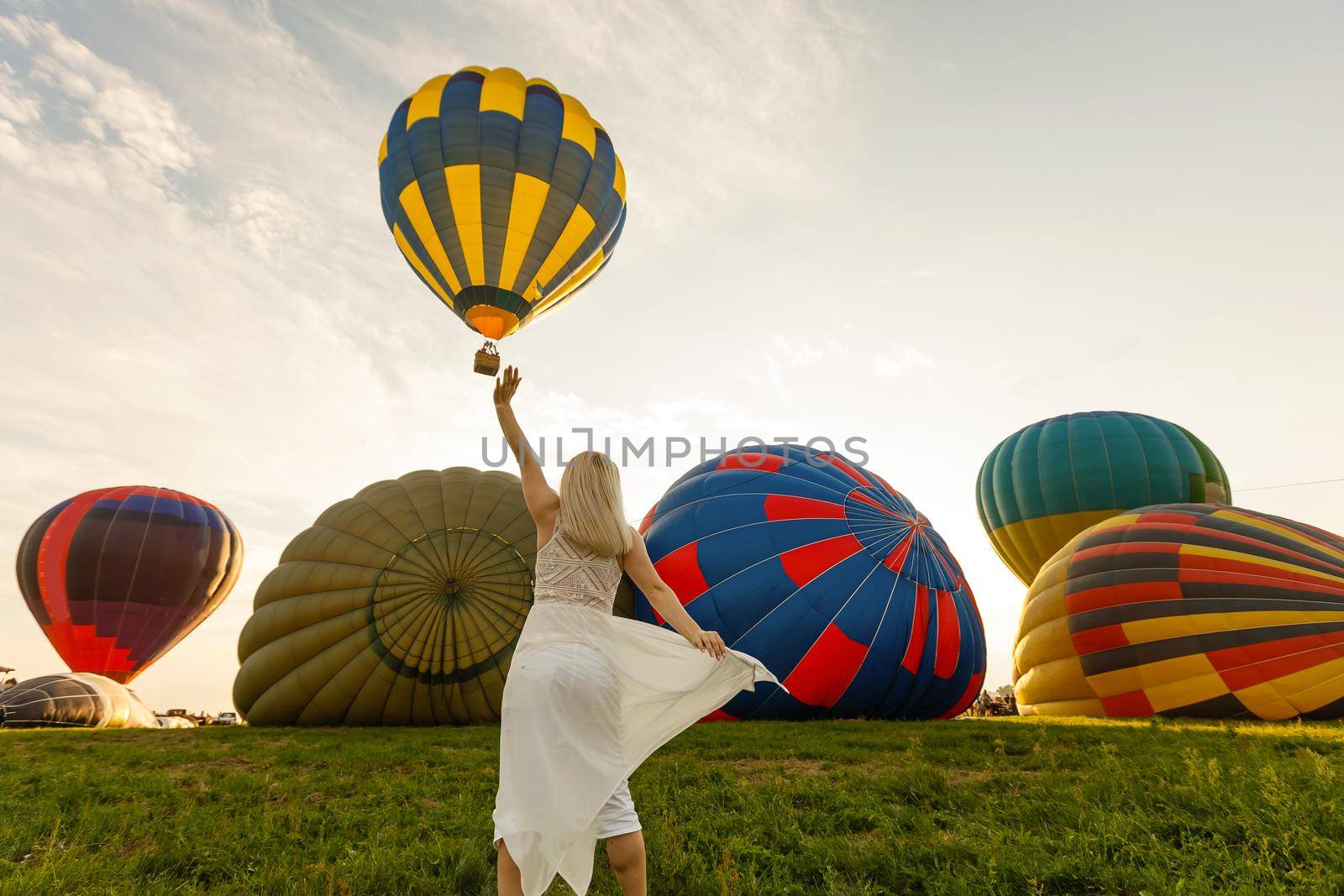 Amazing view with woman and air balloon. Artistic picture. Beauty world. The feeling of complete freedom