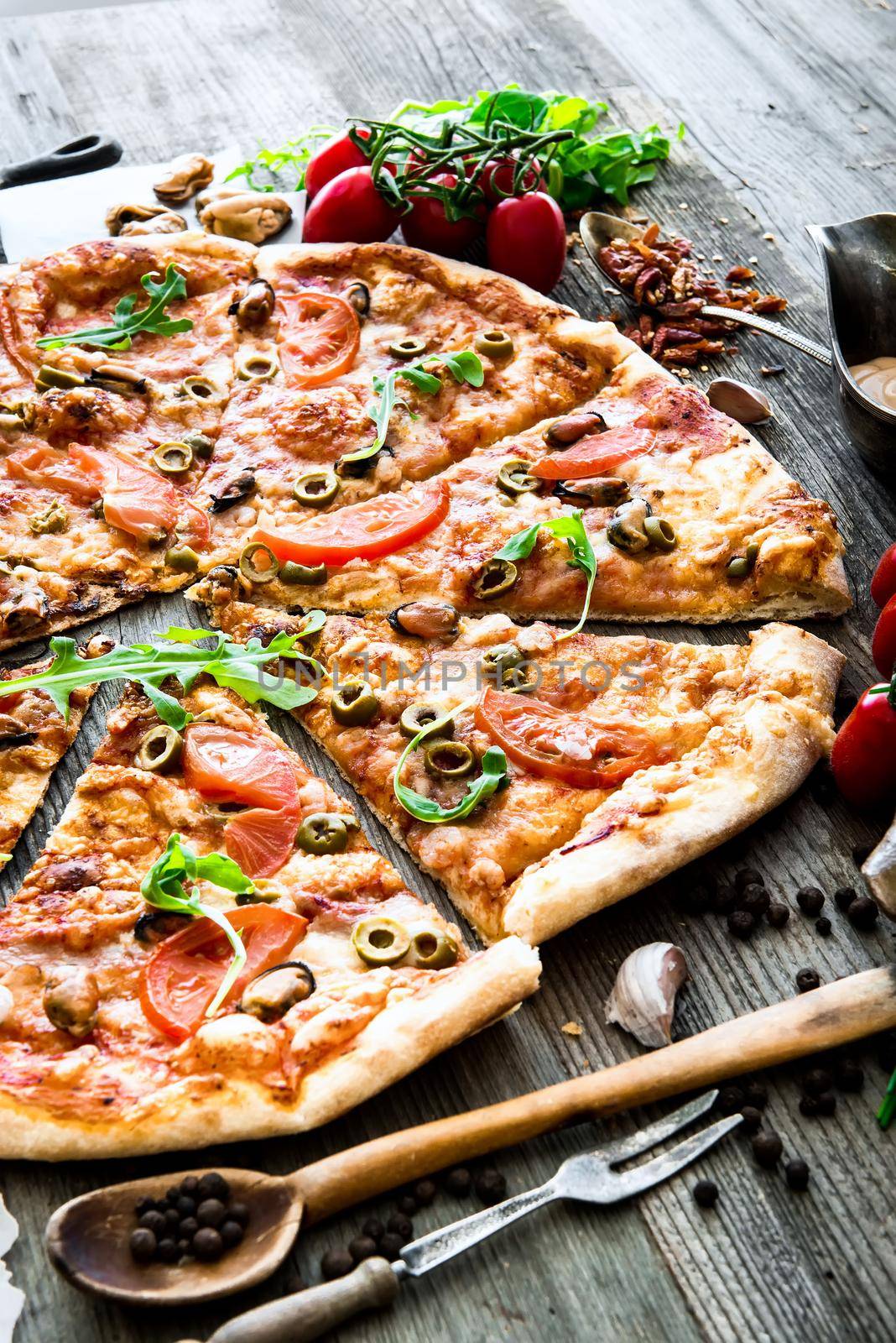 delicious pizza with seafood on wooden table