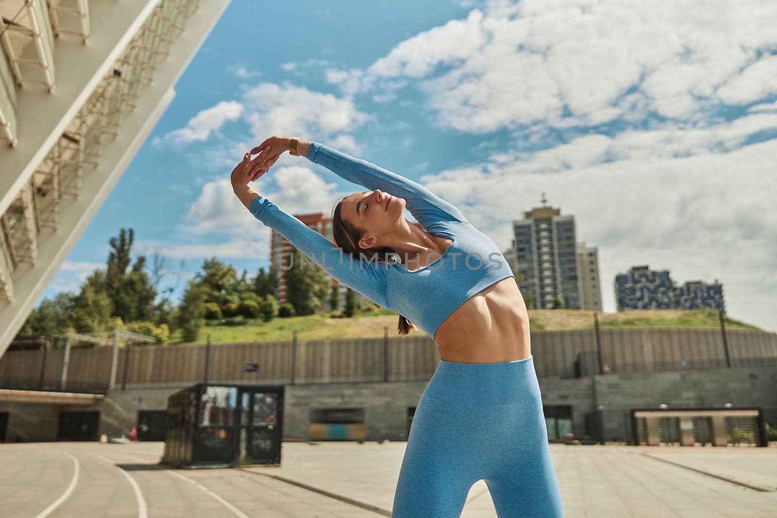 Beautiful fit young woman jogger is running outdoors