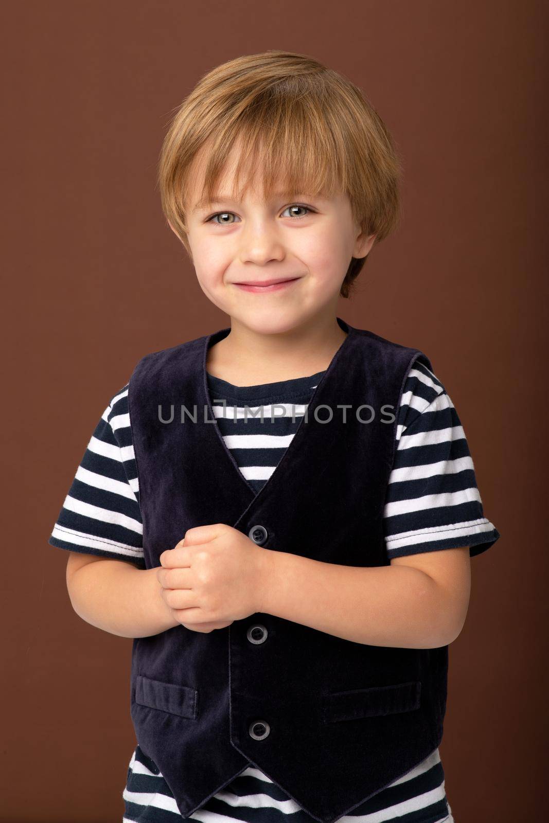 Portrait of happy joyful little boy by kolesnikov_studio