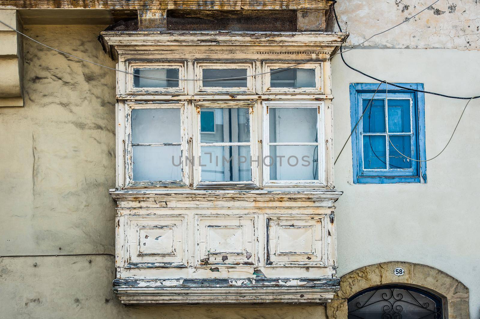 old white vintage balcony in a street of Valletta in Malta