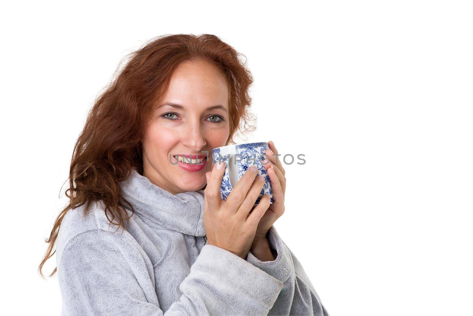 Smiling woman holding porcelain mug by kolesnikov_studio