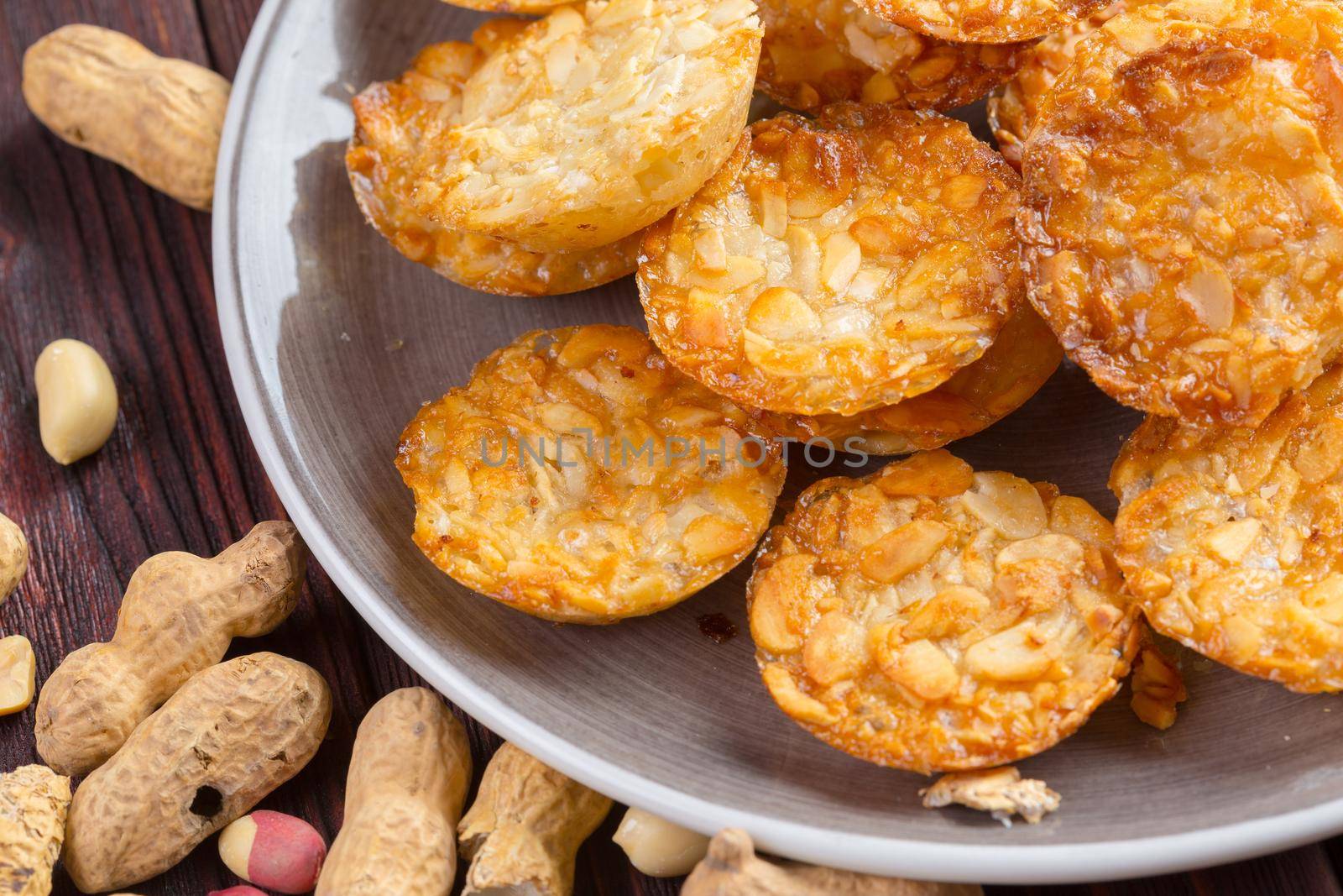 Oat cookies served on dark wooden table close up