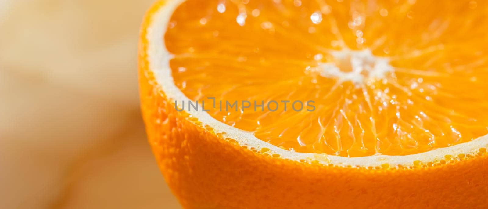 Part of orange on marble onyx background. Round fruit with clipping path.